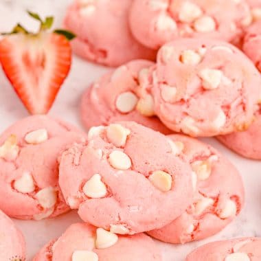 white chocolate strawberry cake mix cookies with a strawberry