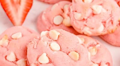 white chocolate strawberry cake mix cookies with a strawberry