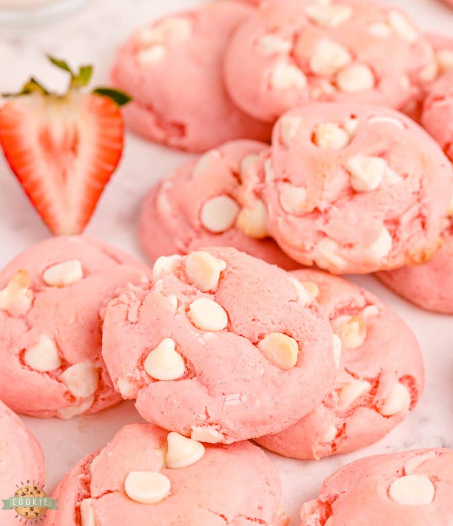 white chocolate strawberry cake mix cookies with a strawberry