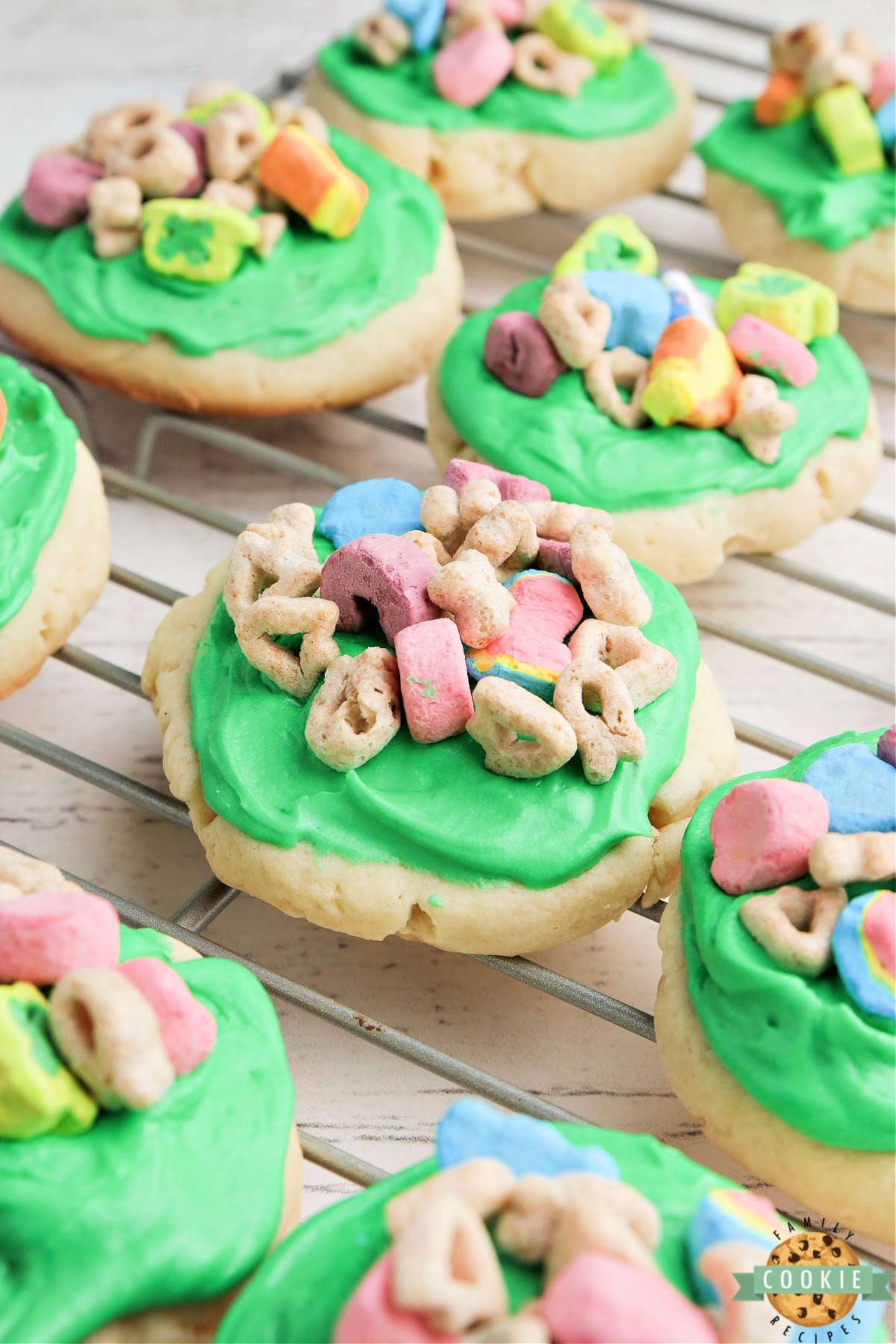 Lucky Charms Sugar Cookies are soft, sweet and perfect for St. Patrick's Day! Absolutely perfect cream cheese sugar cookie recipe frosted with a simple buttercream frosting and topped with Lucky Charms cereal.