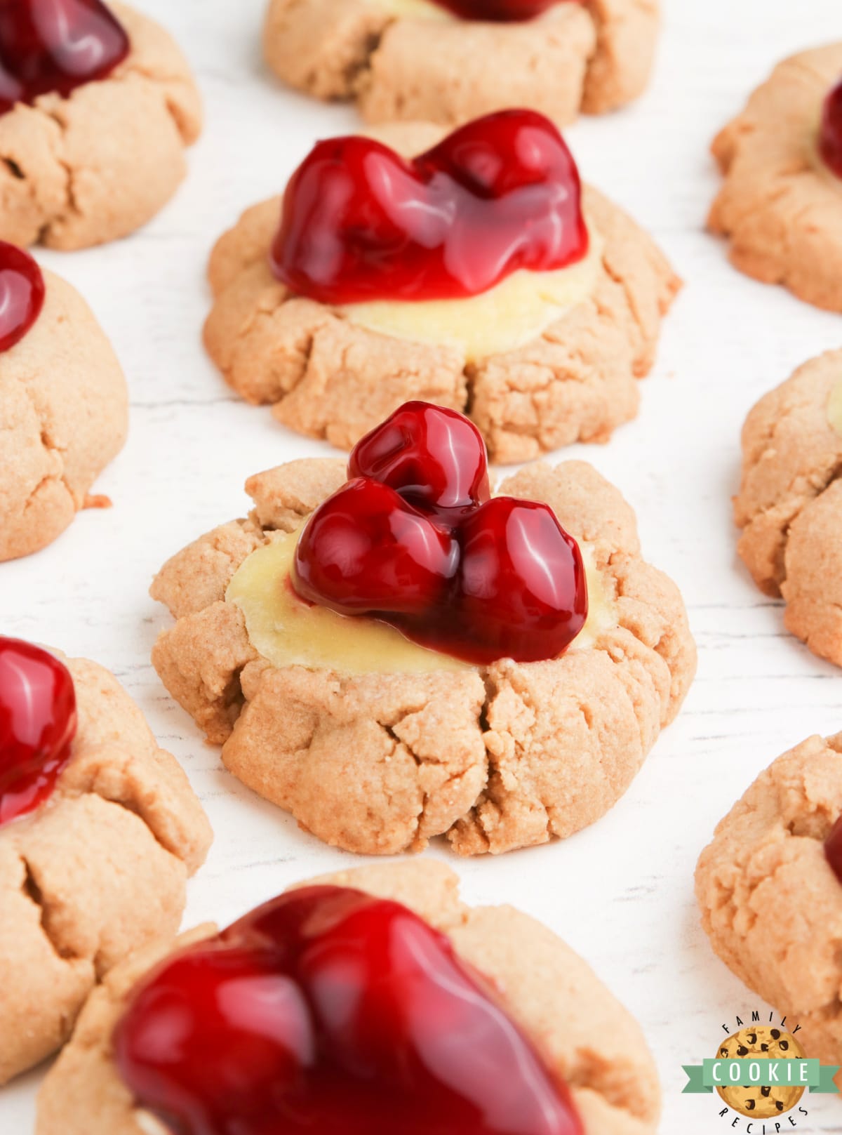 Cheesecake Cookies are graham cracker cookies baked with a simple cheesecake filling and topped with your favorite fruit or pie filling. 