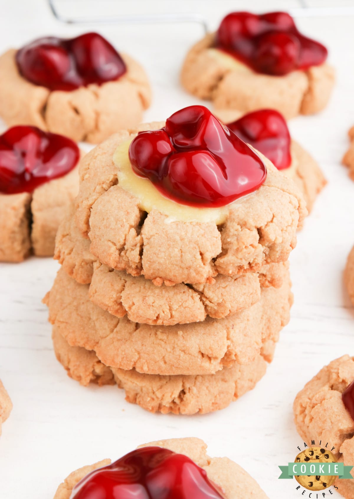 Cheesecake Cookies are graham cracker cookies baked with a simple cheesecake filling and topped with your favorite fruit or pie filling. 