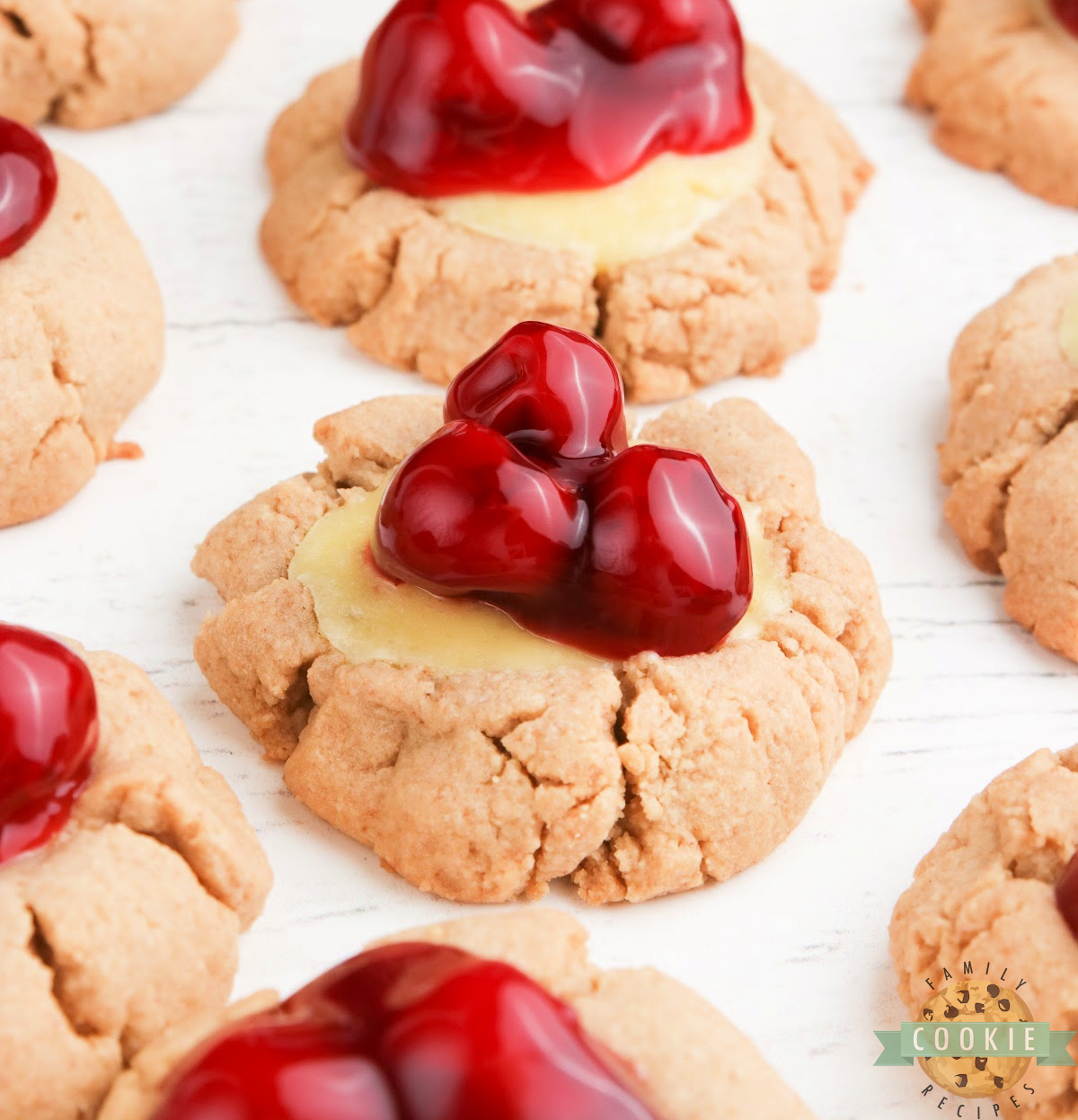 Cheesecake Cookies are soft graham cracker cookies filled with creamy cheesecake and topped with fruit or pie filling for an easy dessert.