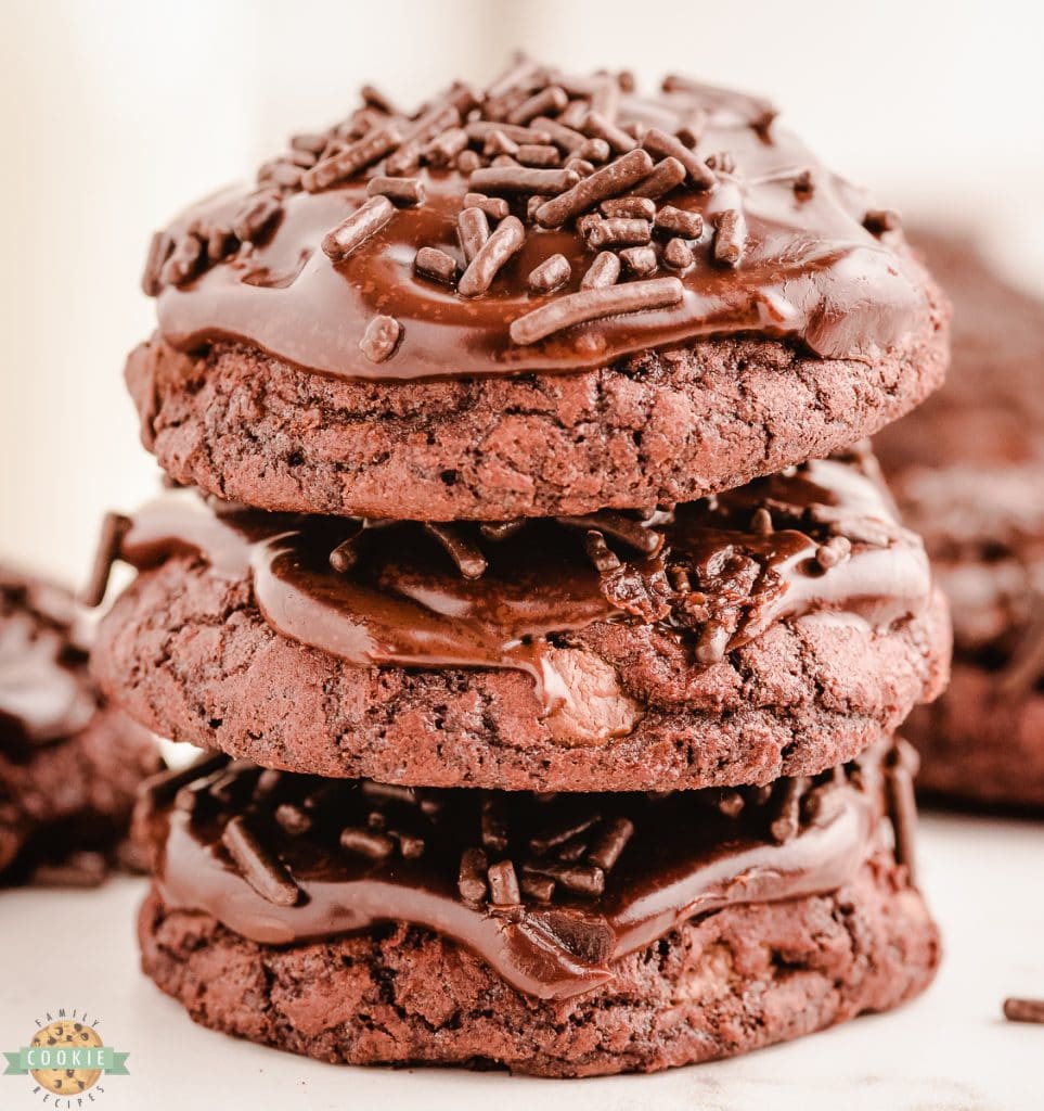 stacked brownie cookies with chocolate frosting and sprinkles