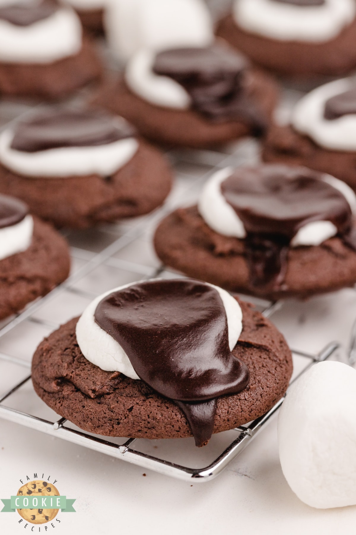 Chocolate Marshmallow Cookies are soft and thick chocolate cookies topped with a marshmallow and chocolate icing. Delicious chocolate cookie recipe with marshmallow.