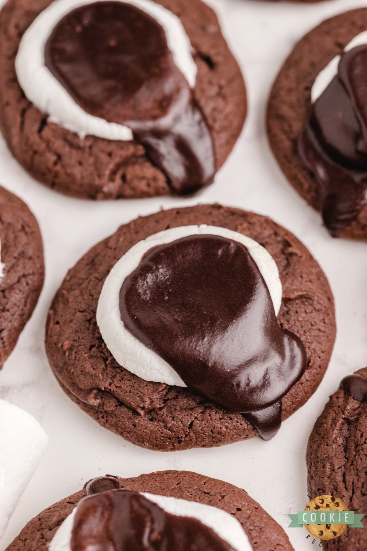 Chocolate Marshmallow Cookies are soft and thick chocolate cookies topped with a marshmallow and chocolate icing. Delicious chocolate cookie recipe with marshmallow.