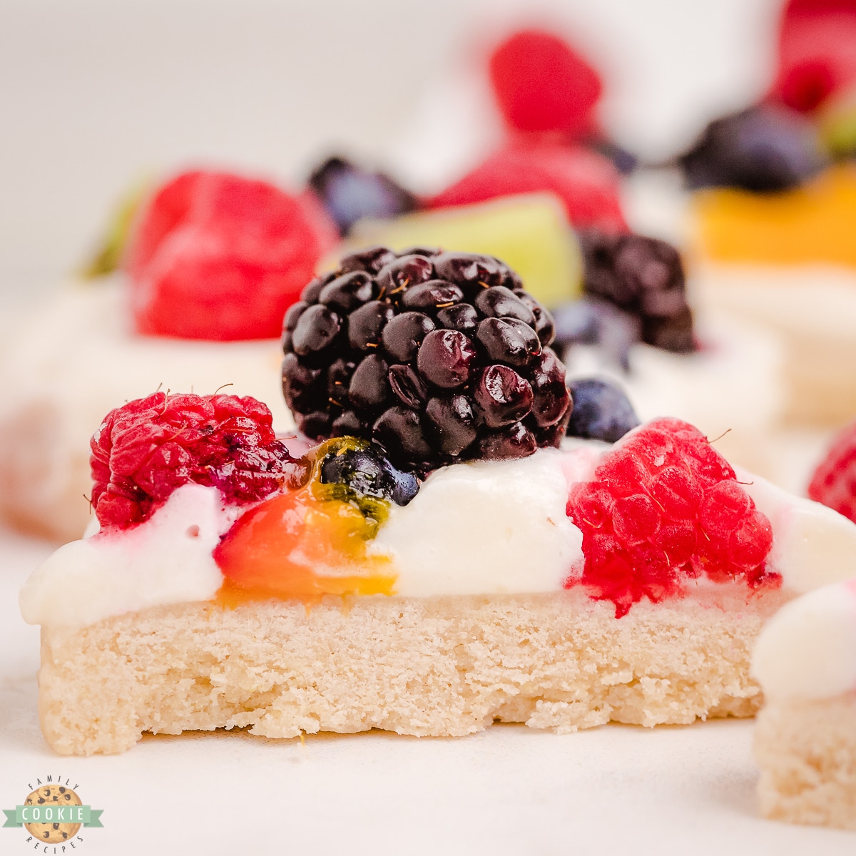 halved fruit pizza cookies with fresh berries and kiwi