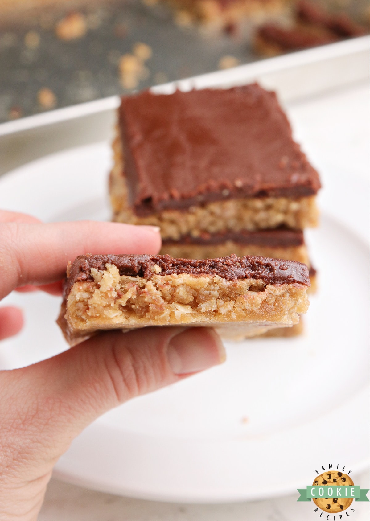 Chocolate frosting on a peanut butter bar