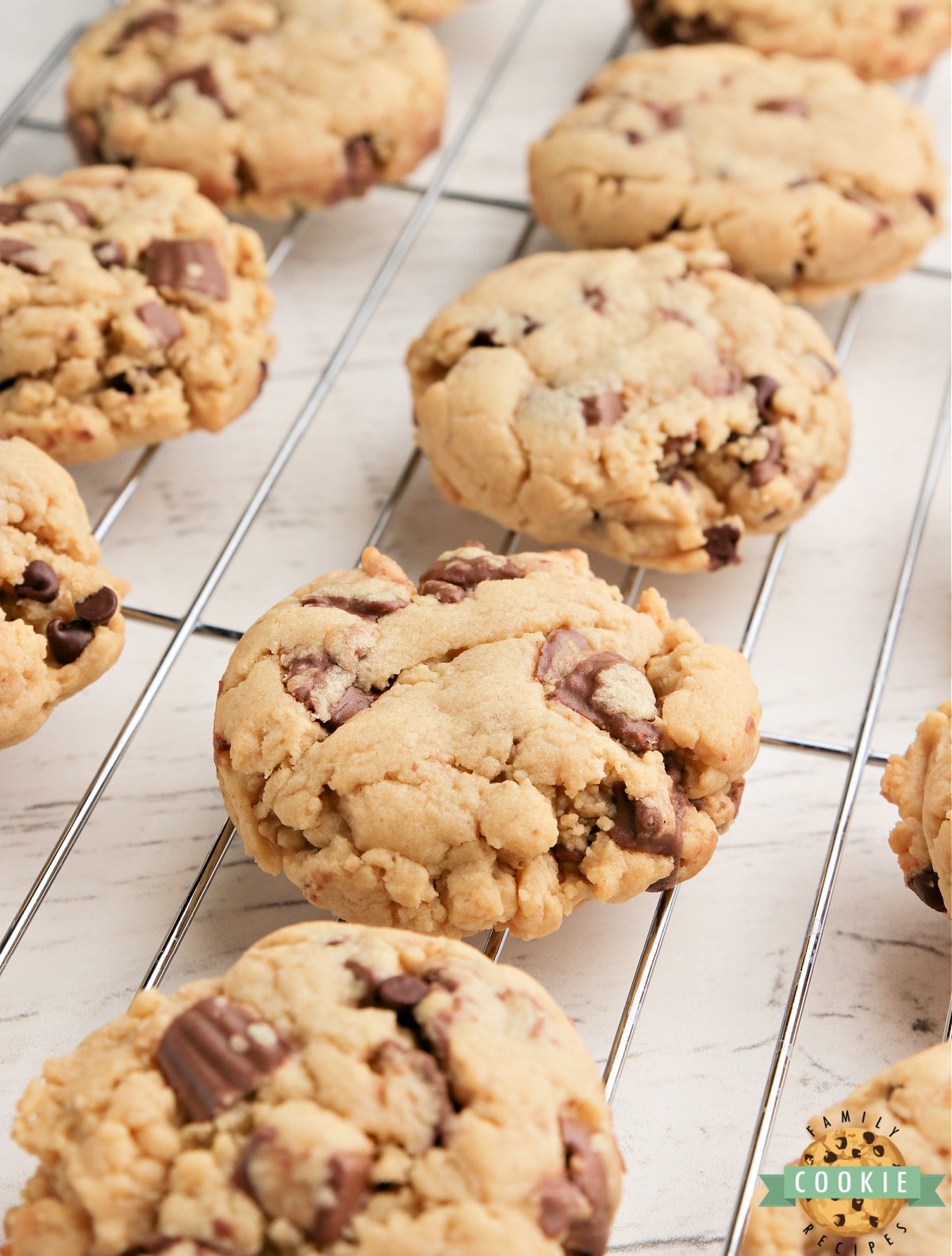 Reese's Peanut Butter Banana Cookies made with Reese's peanut butter cups, chocolate chips, peanut butter and banana pudding mix. Best flavor combination all together in one delicious cookie recipe!