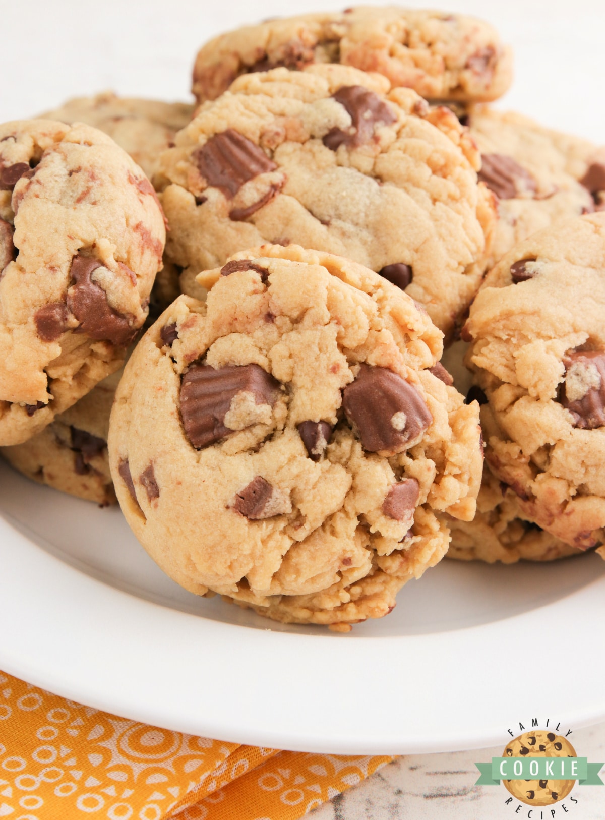 Reese's Peanut Butter Banana Cookies made with Reese's peanut butter cups, chocolate chips, peanut butter and banana pudding mix. Best flavor combination all together in one delicious cookie recipe!