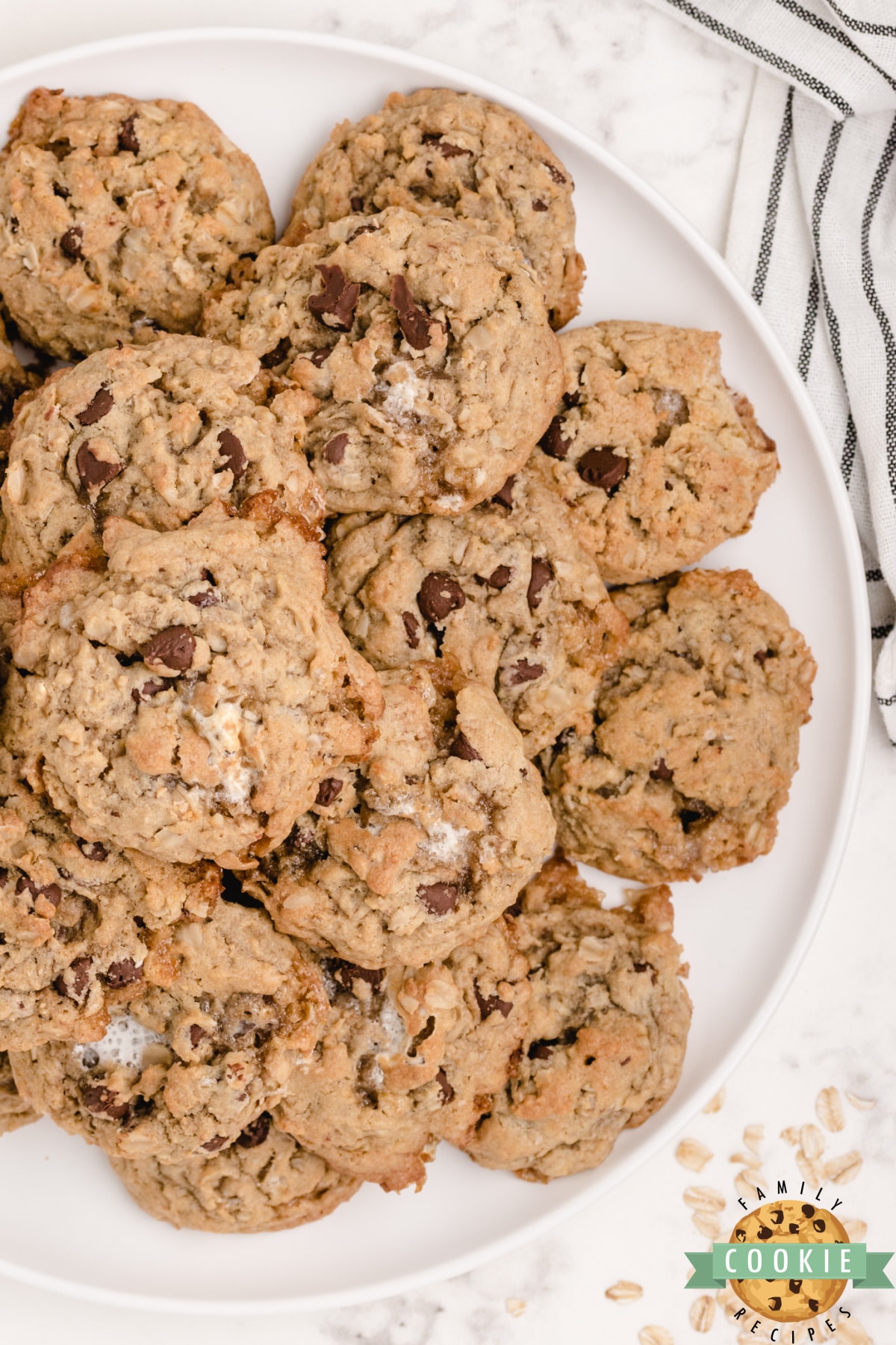 S'mores Oatmeal Cookies are full of oats, chocolate chips and mini marshmallows. Soft, chewy oatmeal cookies that taste just like s'mores! 