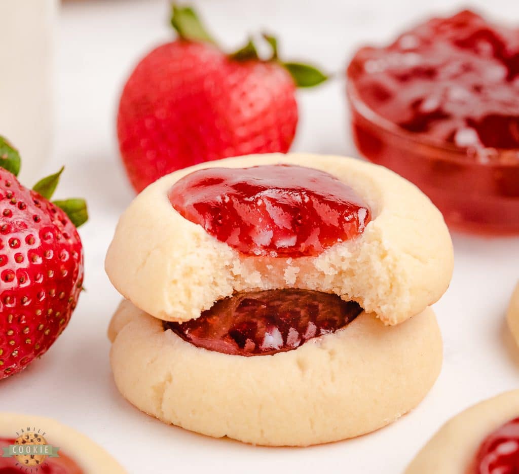 strawberry jam cookies with a bite taken out