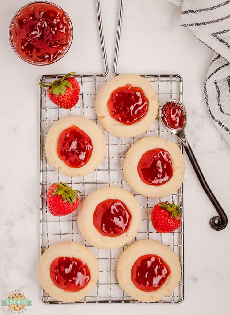 strawberry thumbprint cookies on a cooling rack
