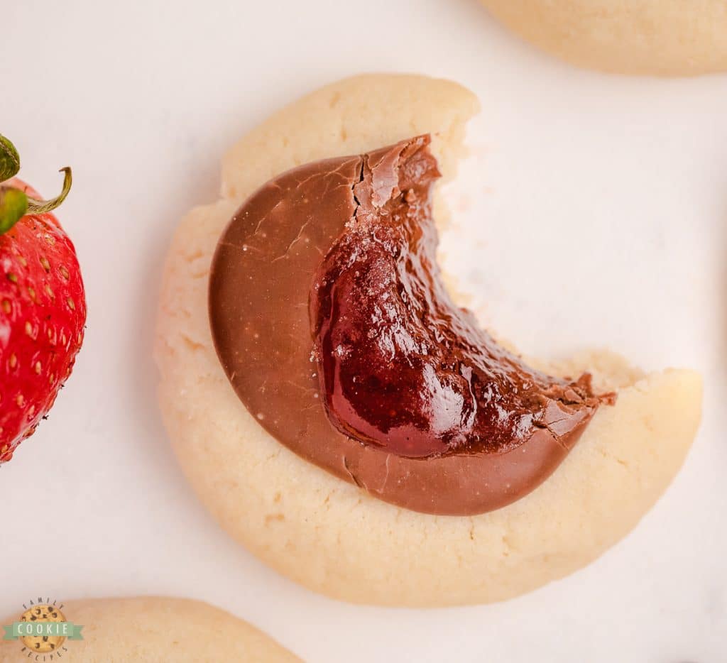 bite of a chocolate strawberry jam cookie