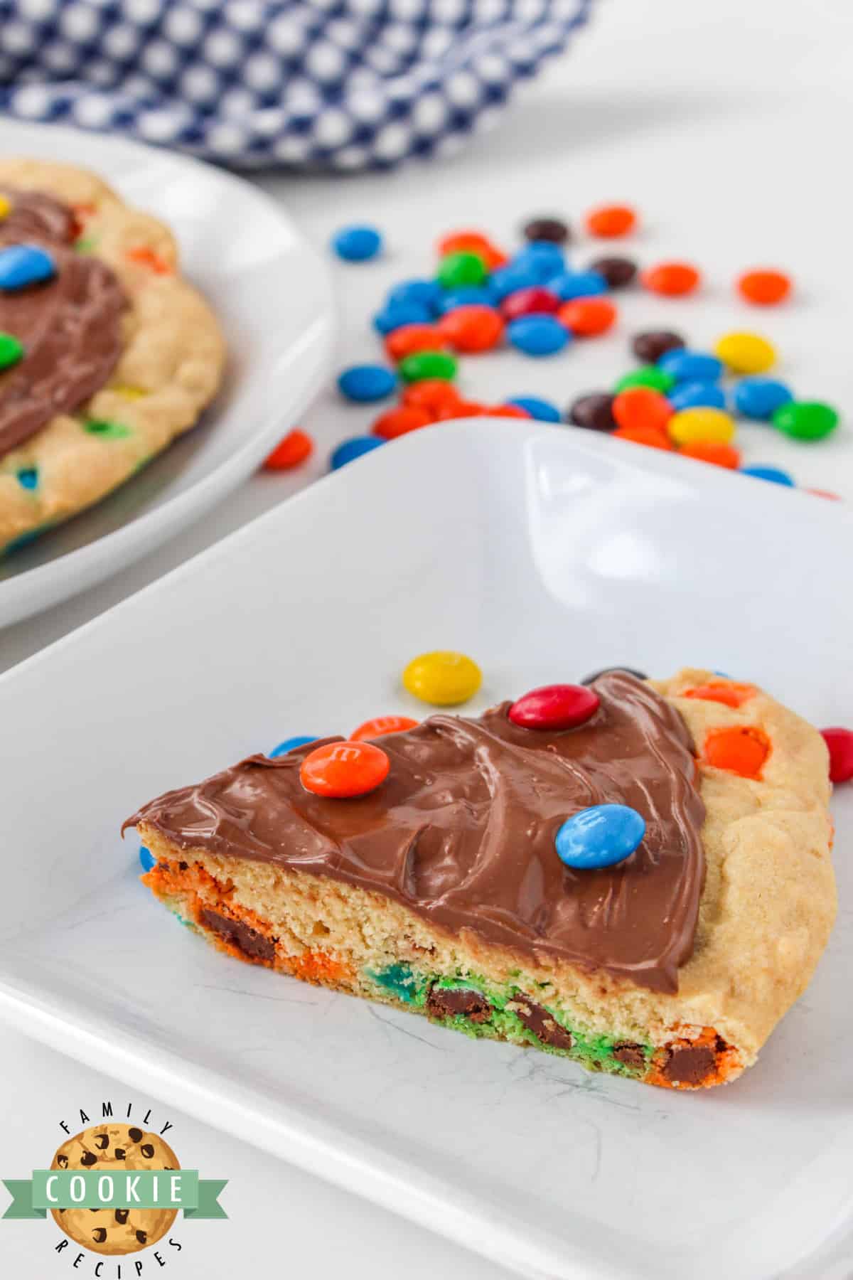 M&M Cookie Pizza is soft, chewy and covered in chocolate. This skillet cookie recipe is easy to make completely from scratch and everyone will love it! 