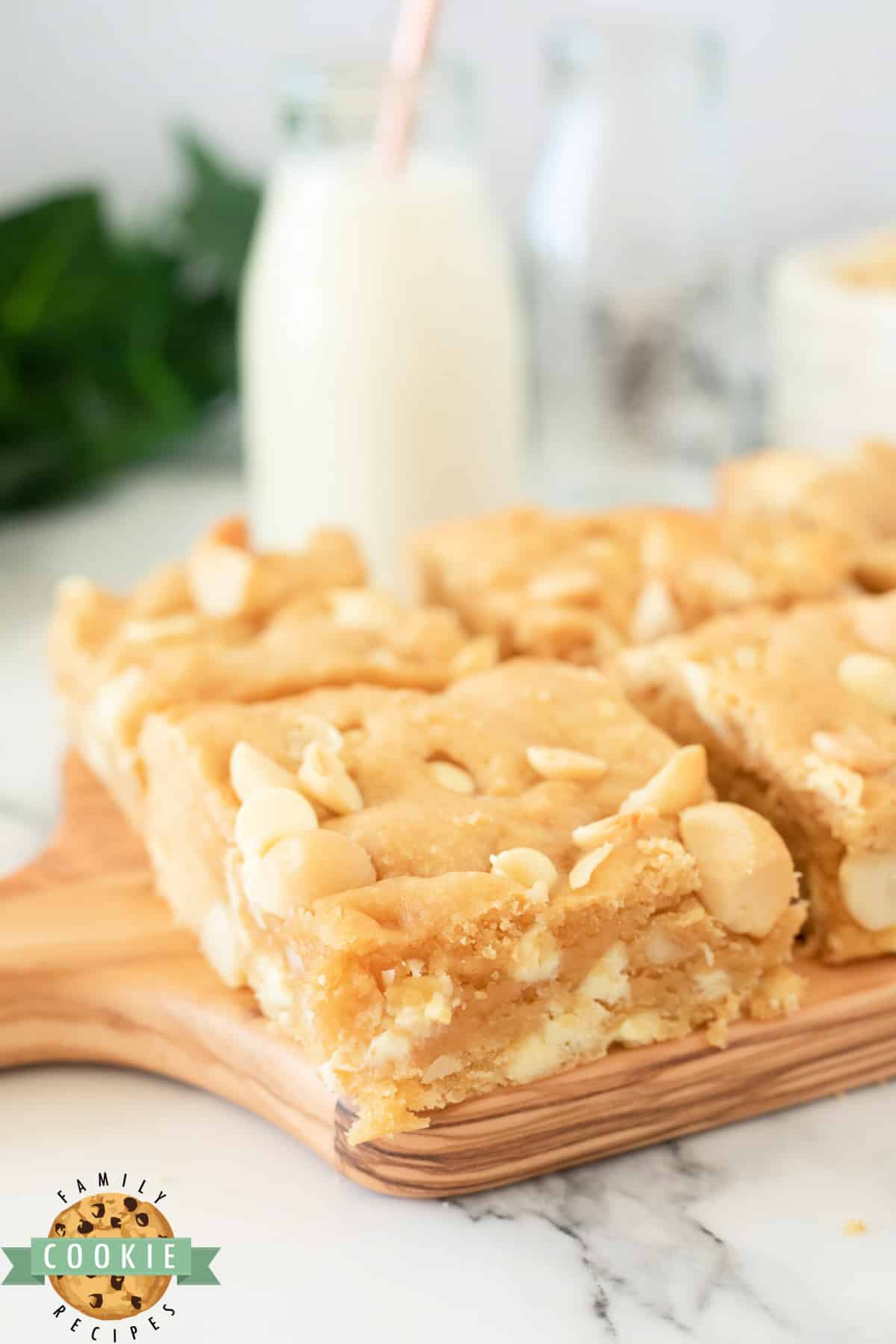 White Chocolate Macadamia Cookie Bars are thick, soft and absolutely delicious. Simple cookie bar recipe packed with white chocolate chips and macadamia nuts. 