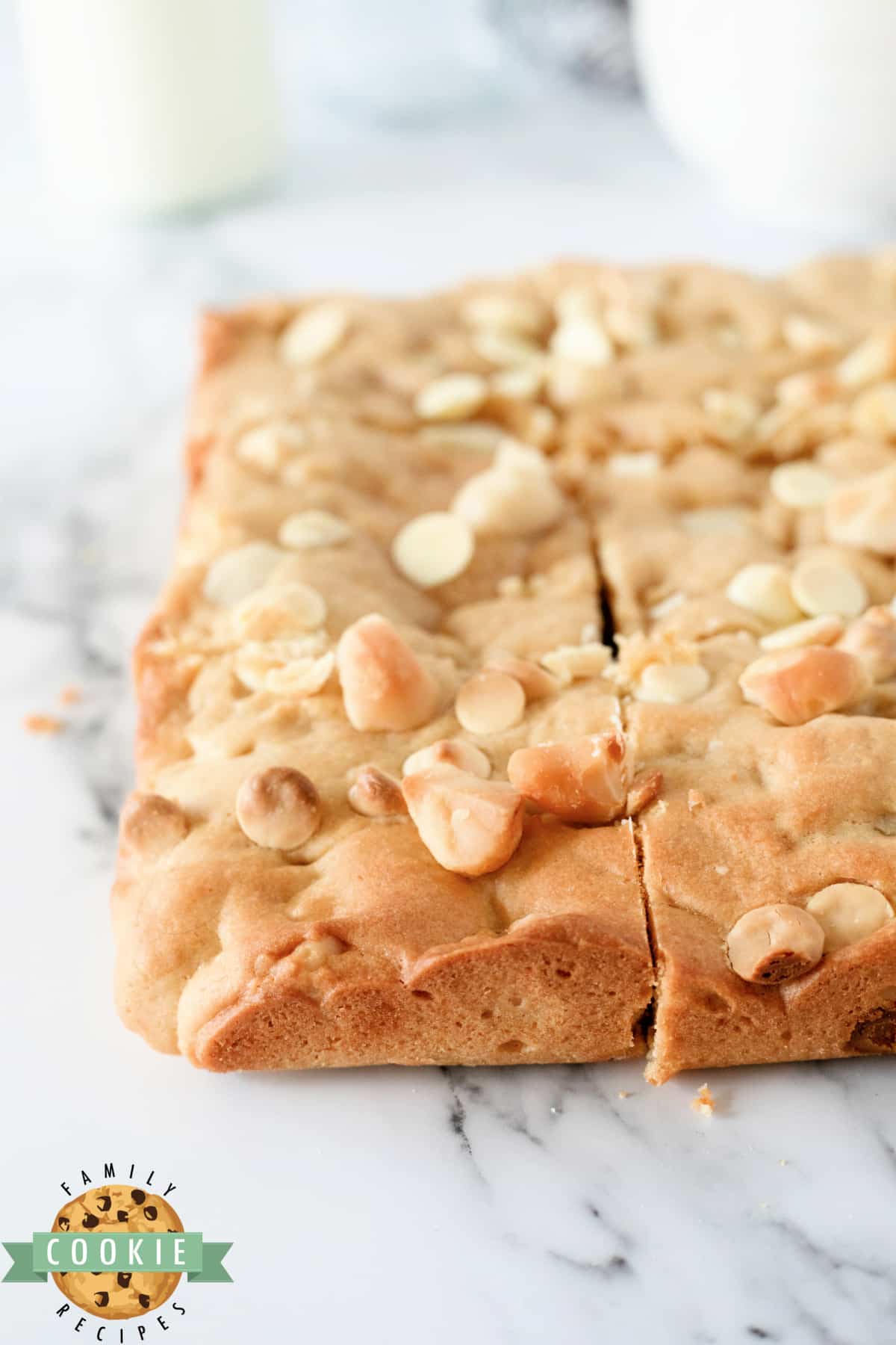 Cookie bars made with white chocolate chips and macadamia nuts