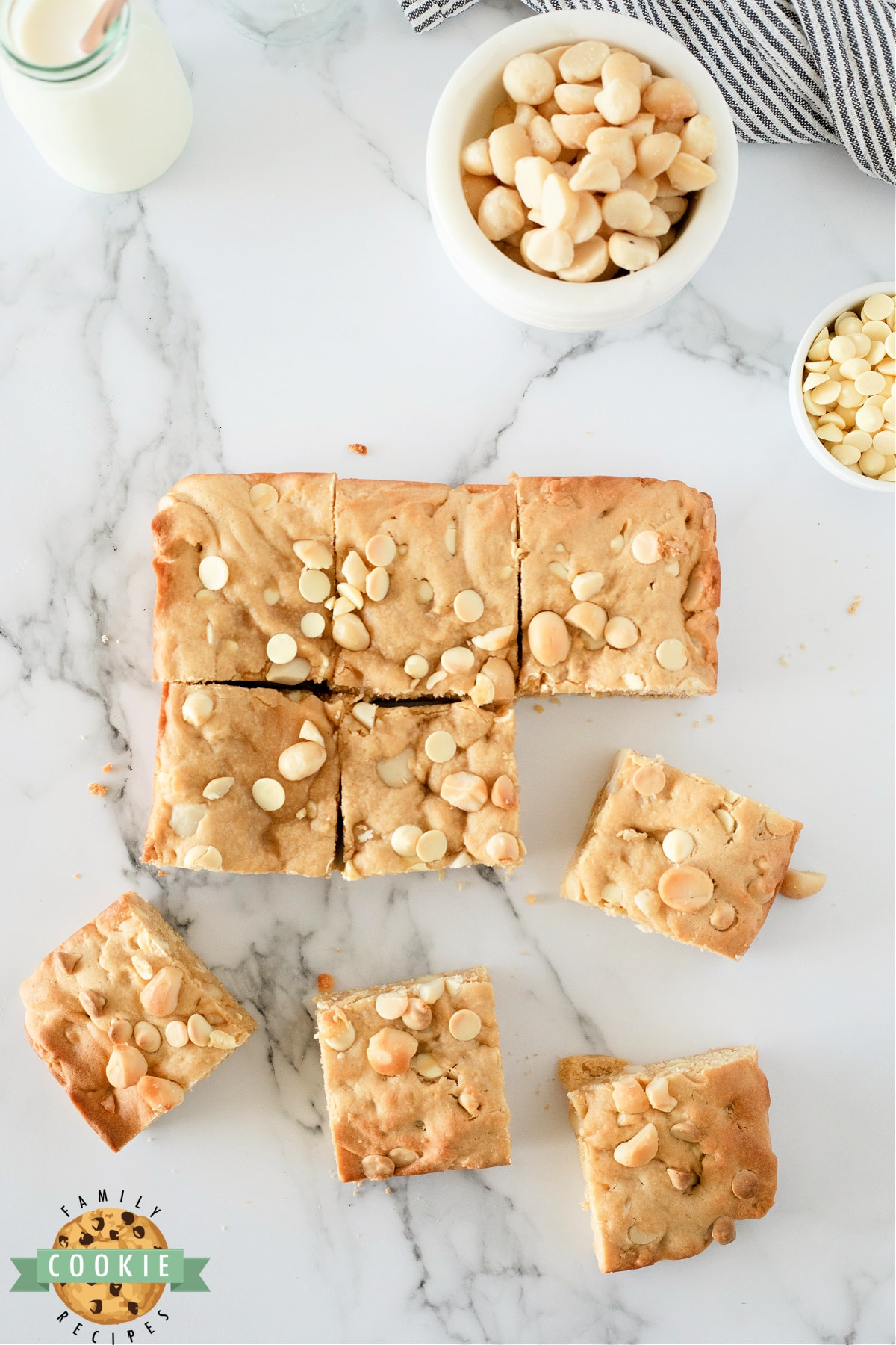 White Chocolate Macadamia Cookie Bars are thick, soft and absolutely delicious. Simple cookie bar recipe packed with white chocolate chips and macadamia nuts. 