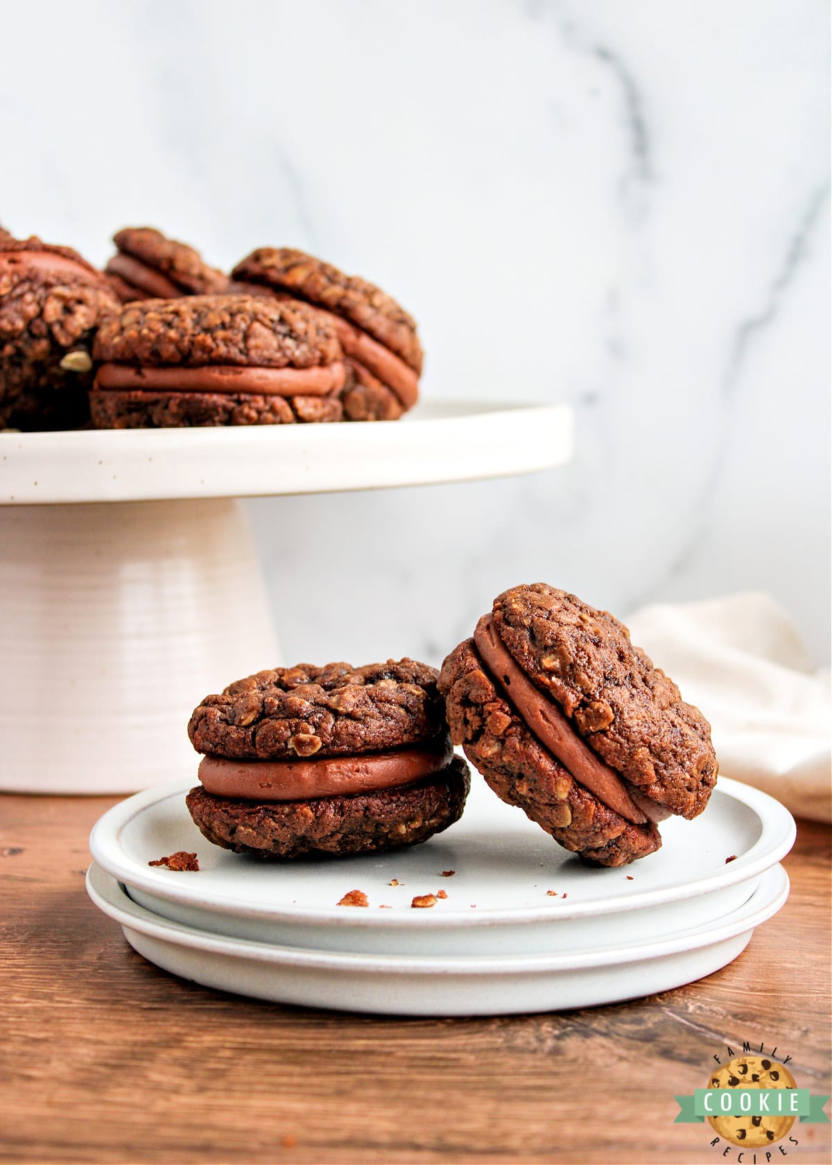 Chocolate Oatmeal Cream Pies are cookie sandwiches made with a simple chocolate buttercream frosting in between soft and chewy chocolate oatmeal cookies.