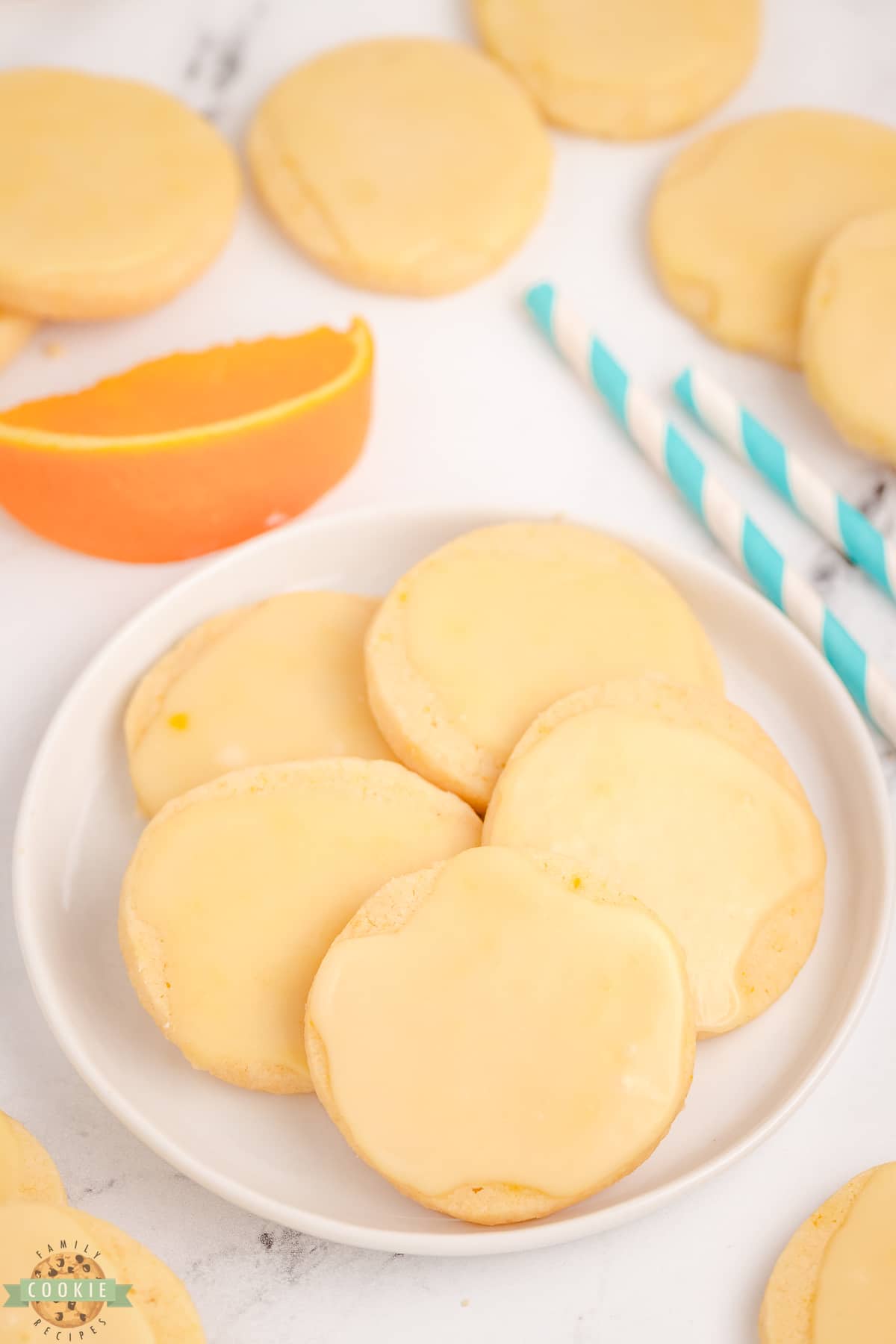 orange shortbread cookies on a white plate