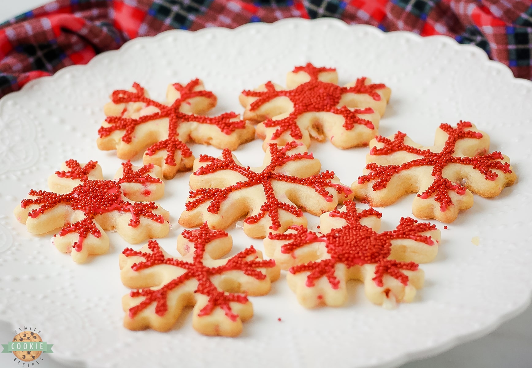 red snowflake peppermint cookies on a plate