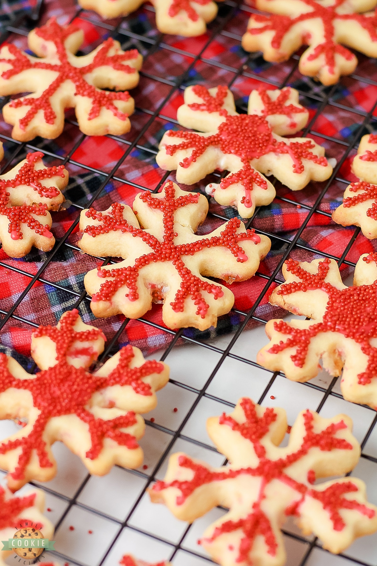 peppermint snowflake cookies on a cooling rack