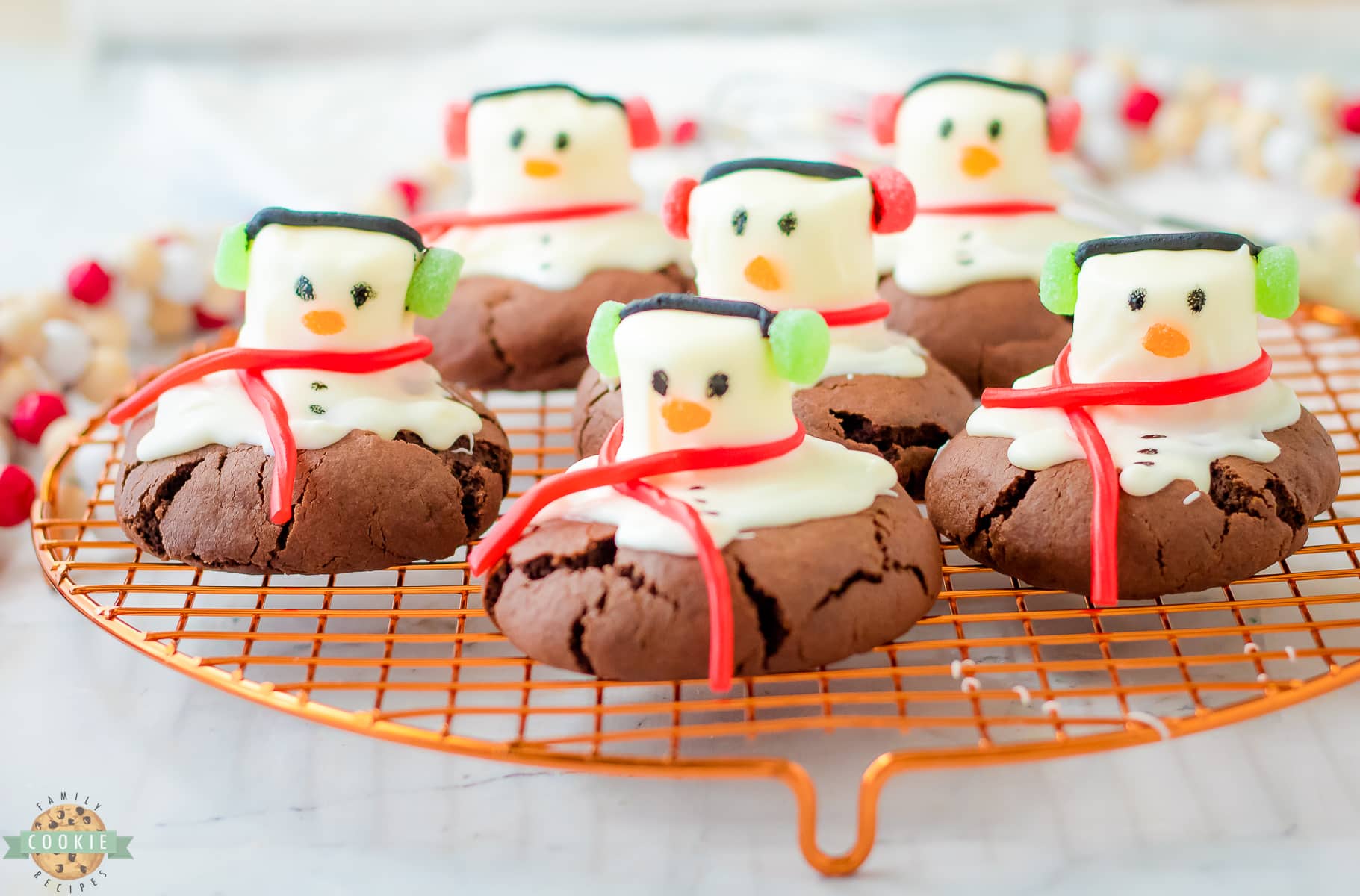 peppermint snowman cookies on a cooling rack