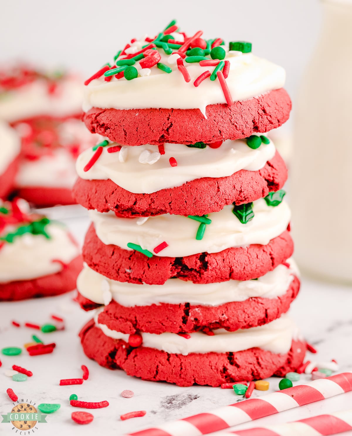 stack of red velvet cookies with Christmas sprinkles