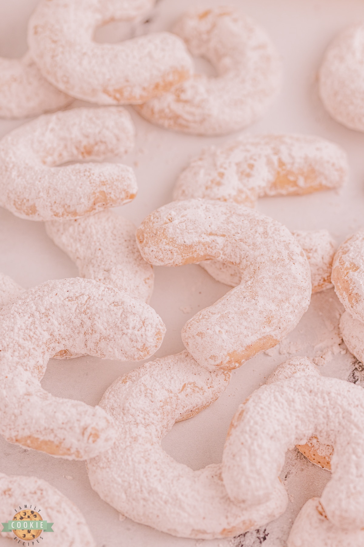 crescent cookies covered in powdered sugar