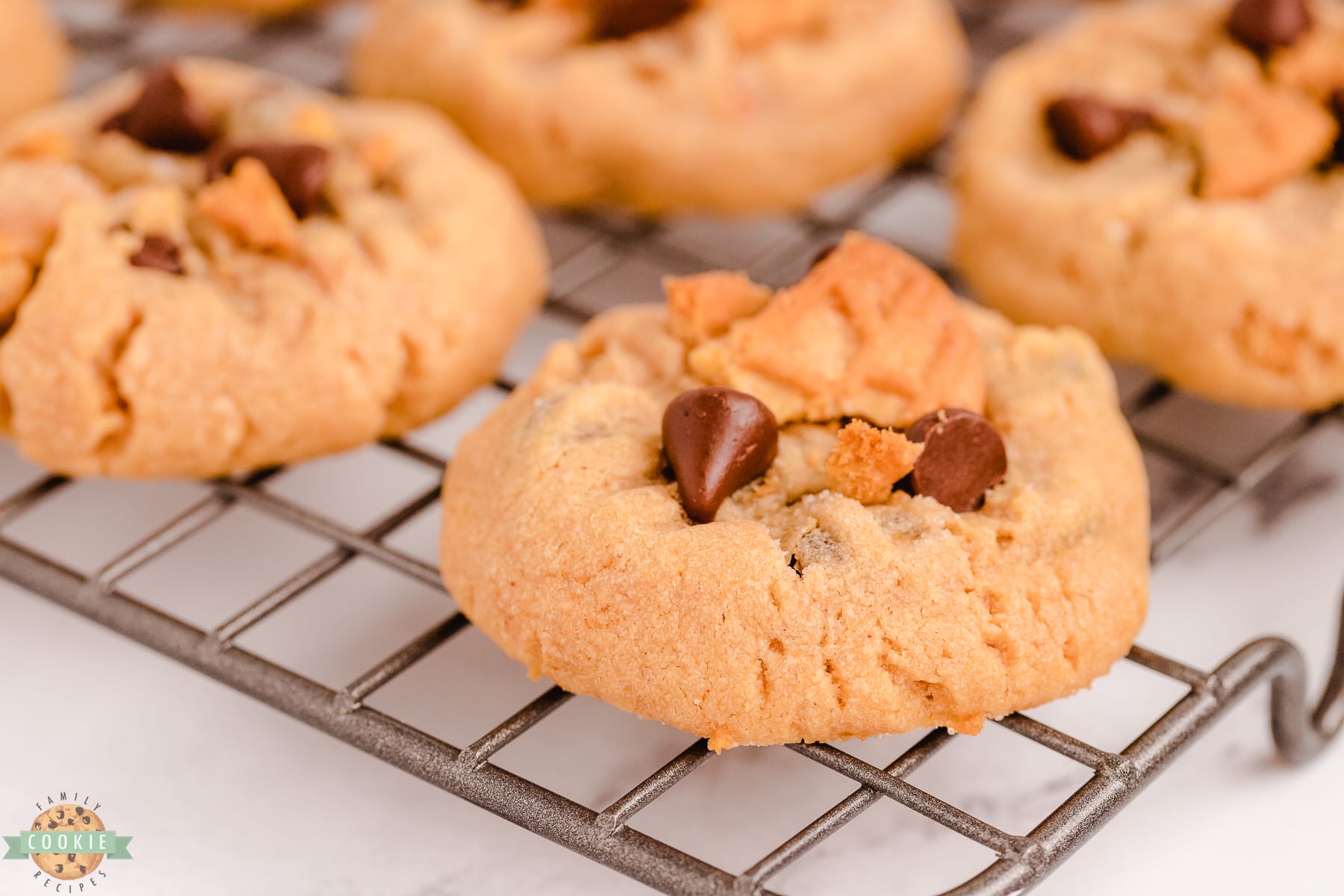 peanut butter chocolate chip cookie on a cooling rack