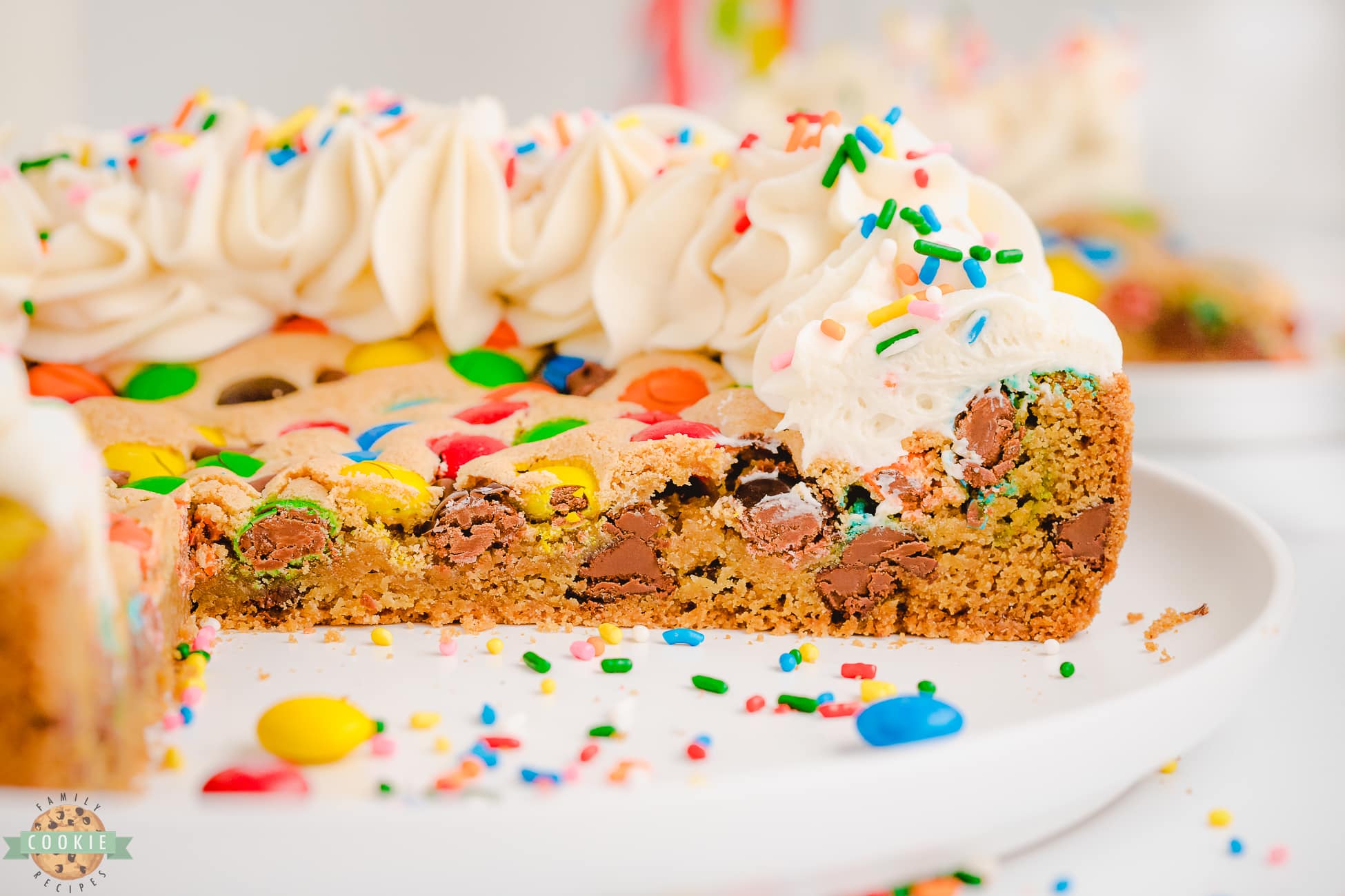 chocolate chip M&M cookie cake cut into