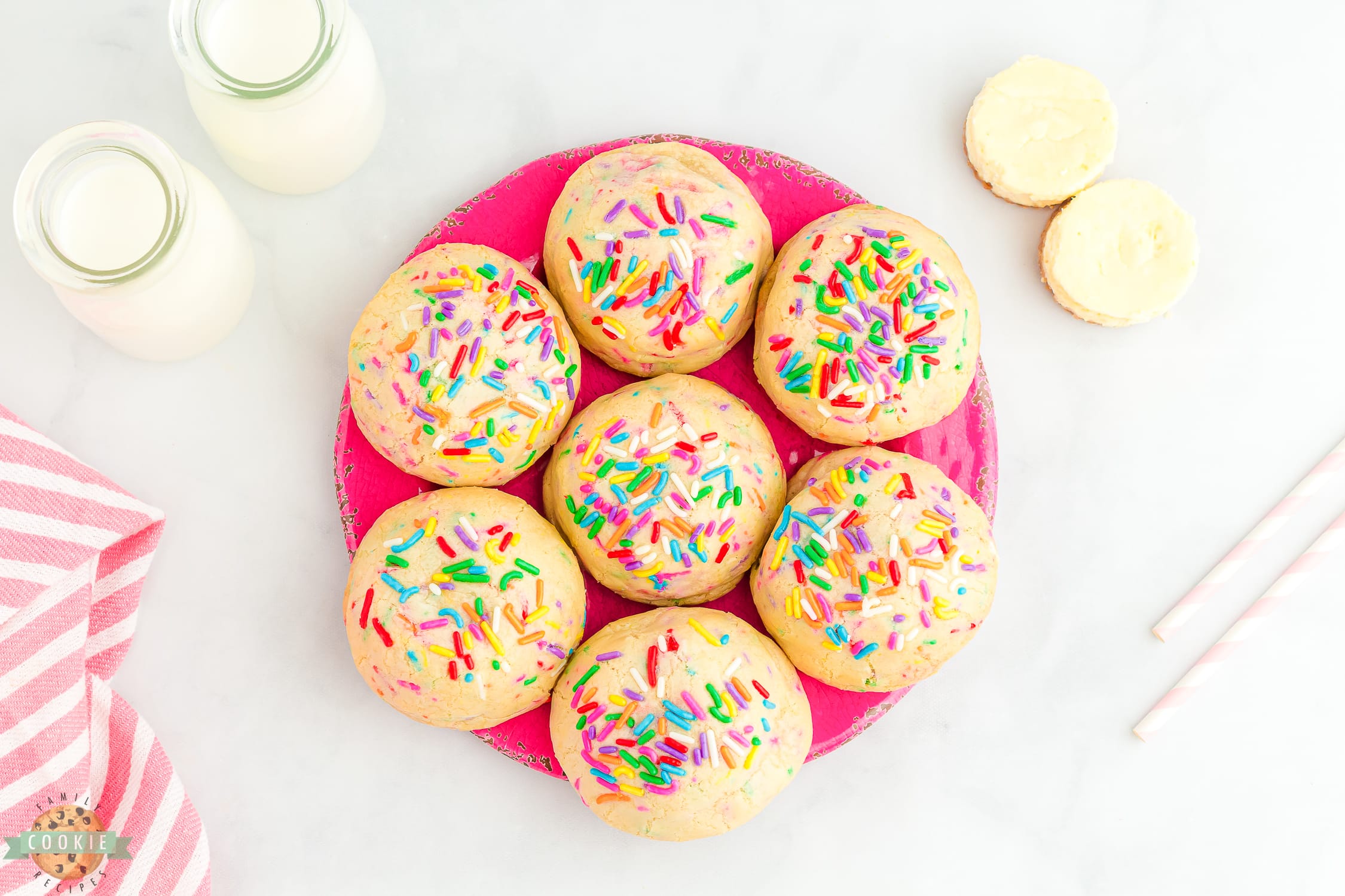 pink tray of cheesecake stuffed funfetti cookies