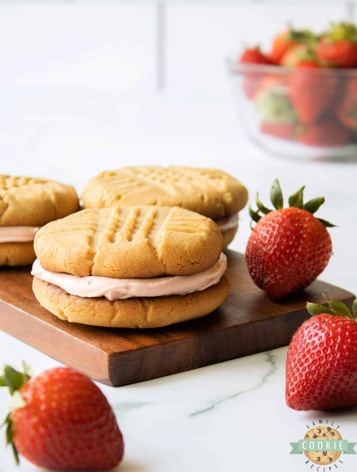Peanut butter cookie sandwich with strawberry buttercream in the middle