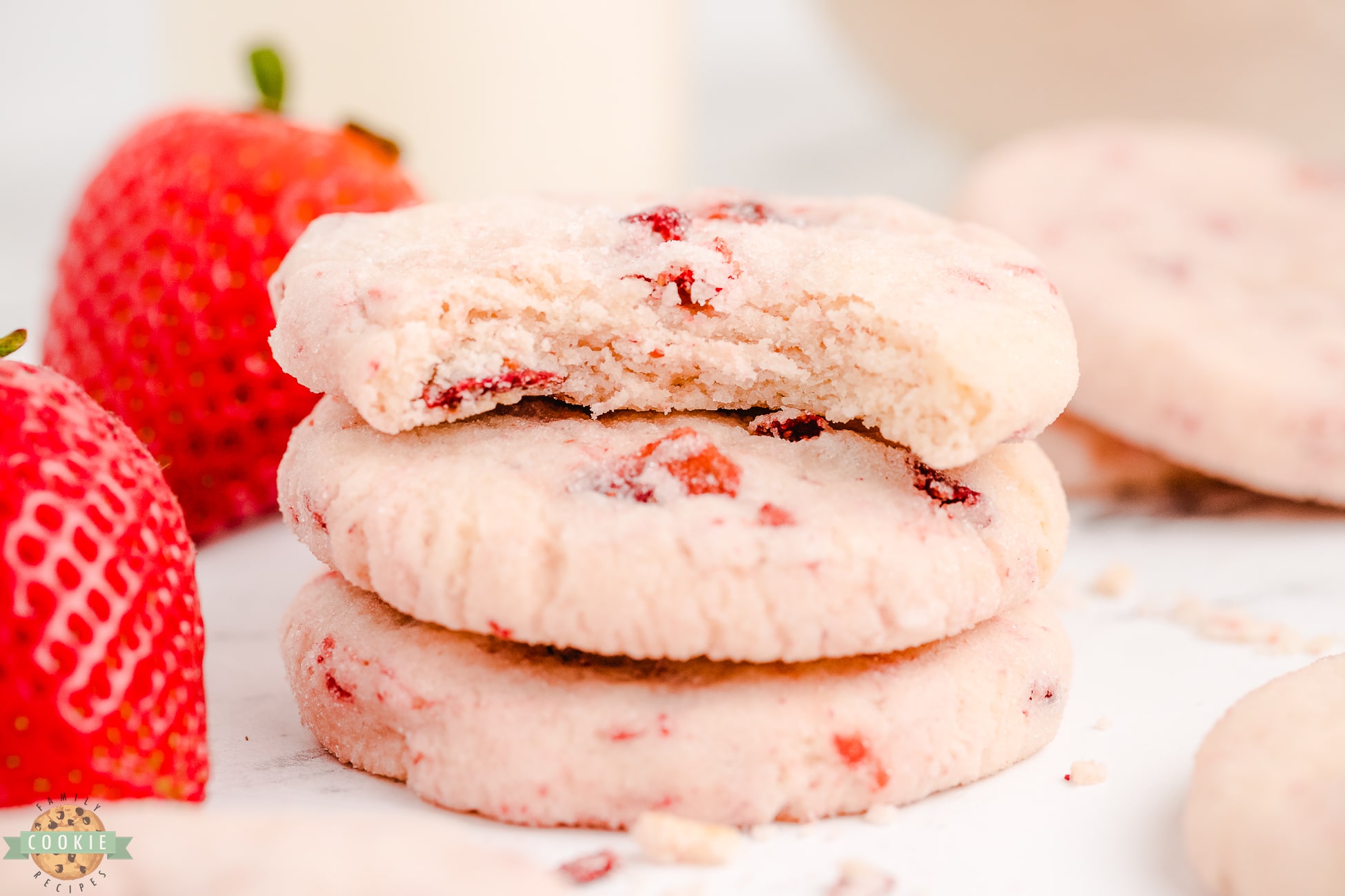 bite out of a strawberry cream cheese sugar cookie