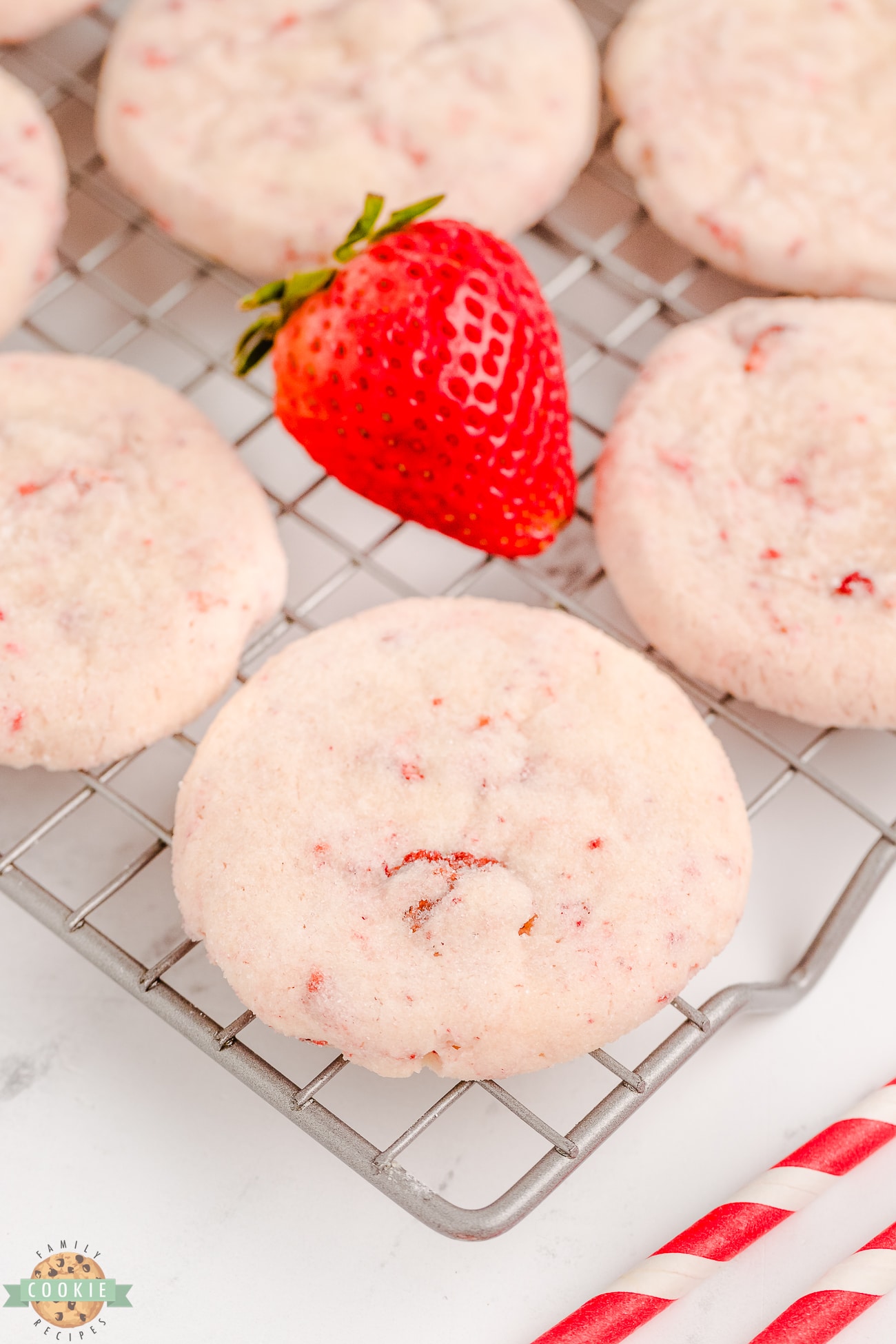 cream cheese strawberry cookies on a cooling rack
