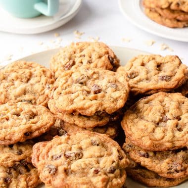 stacks of chewy oatmeal raisin cookies on a plate