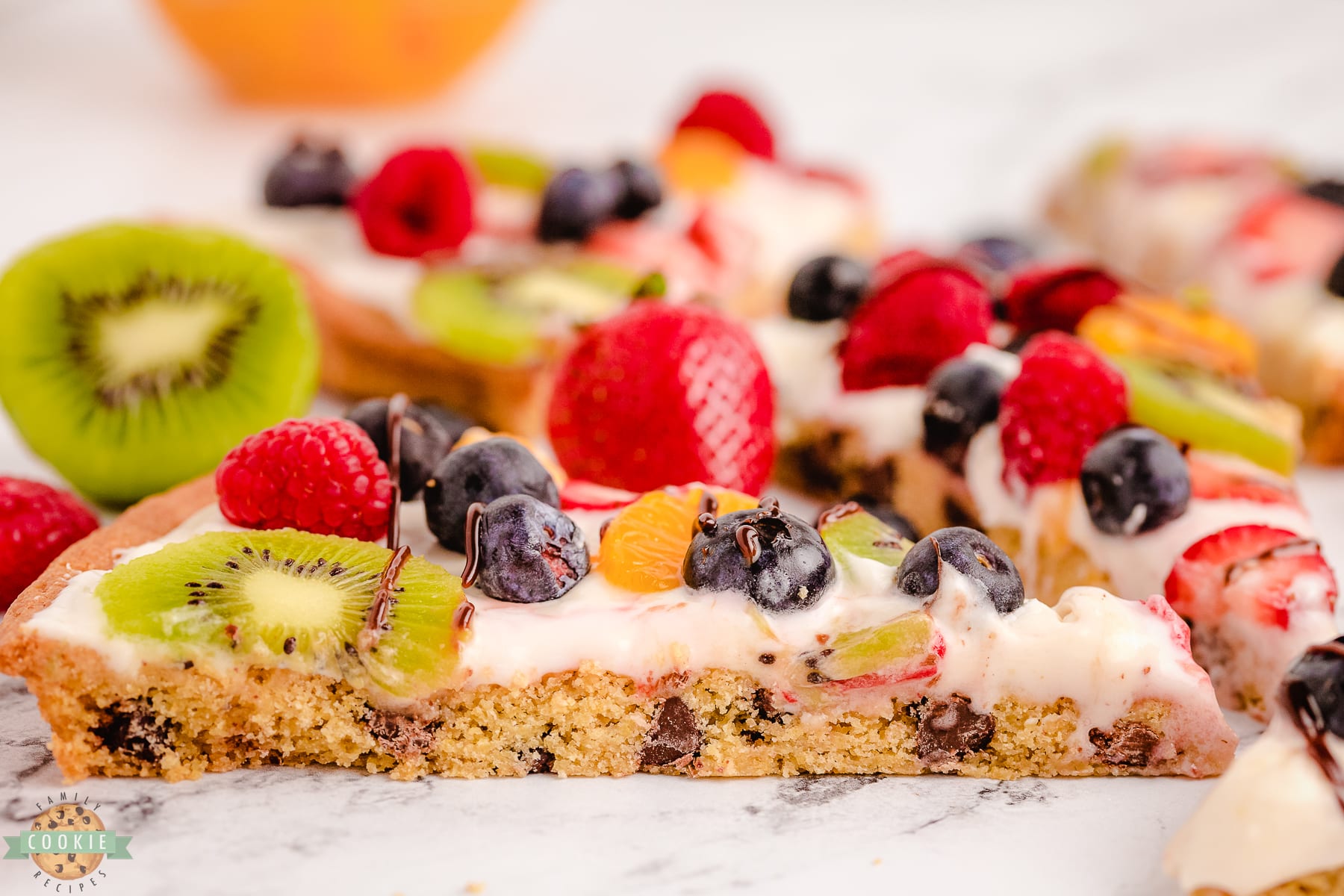 slice of chocolate chip cookie pizza with fruit