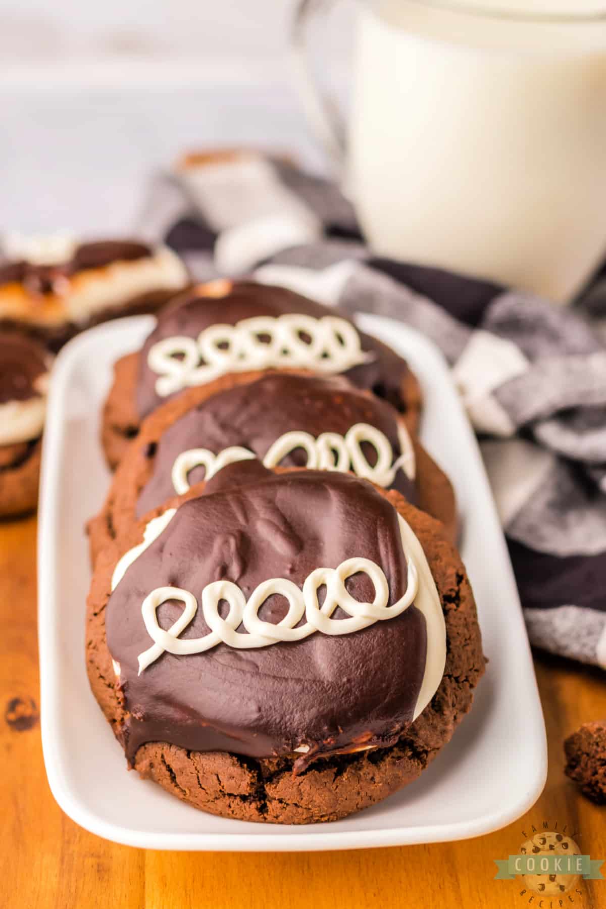 Chocolate cookies frosted with marshmallow buttercream and chocolate ganache