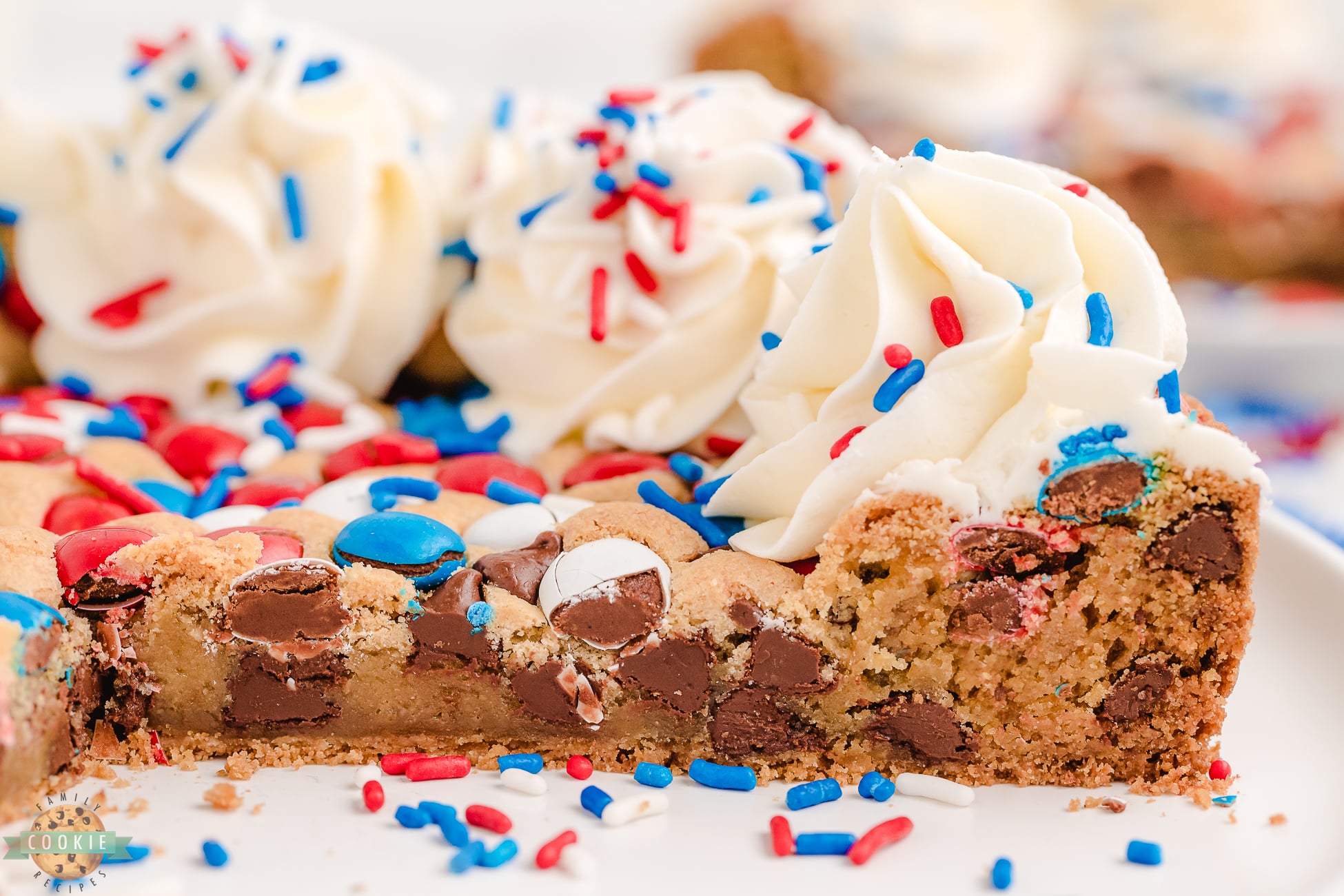 side angel of a slice of red, white and blue cookie cake