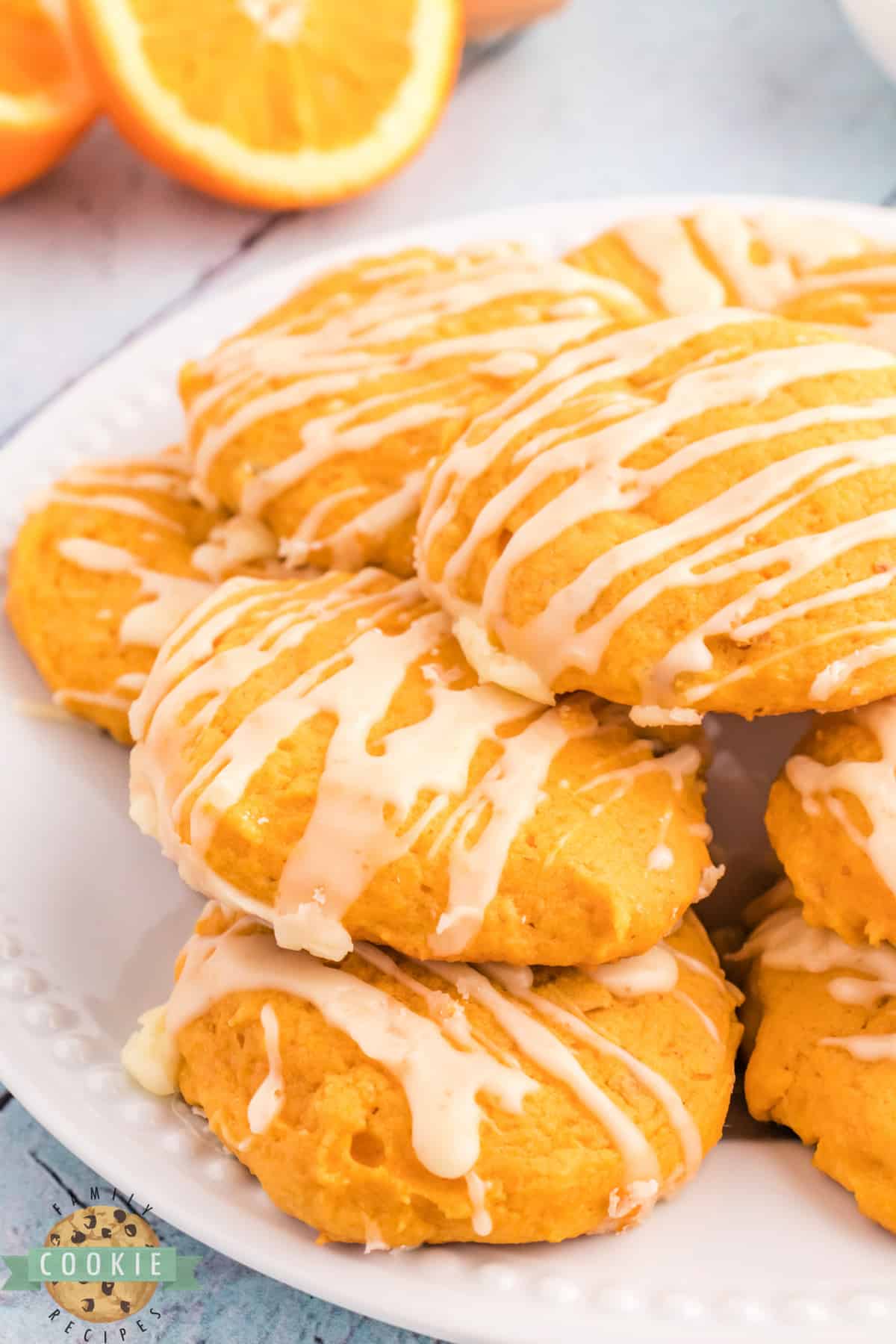 Orange Pumpkin Cookies are soft, chewy and perfect for fall! This pumpkin cookie recipe is topped with a simple orange glaze that complements the pumpkin flavor perfectly. 