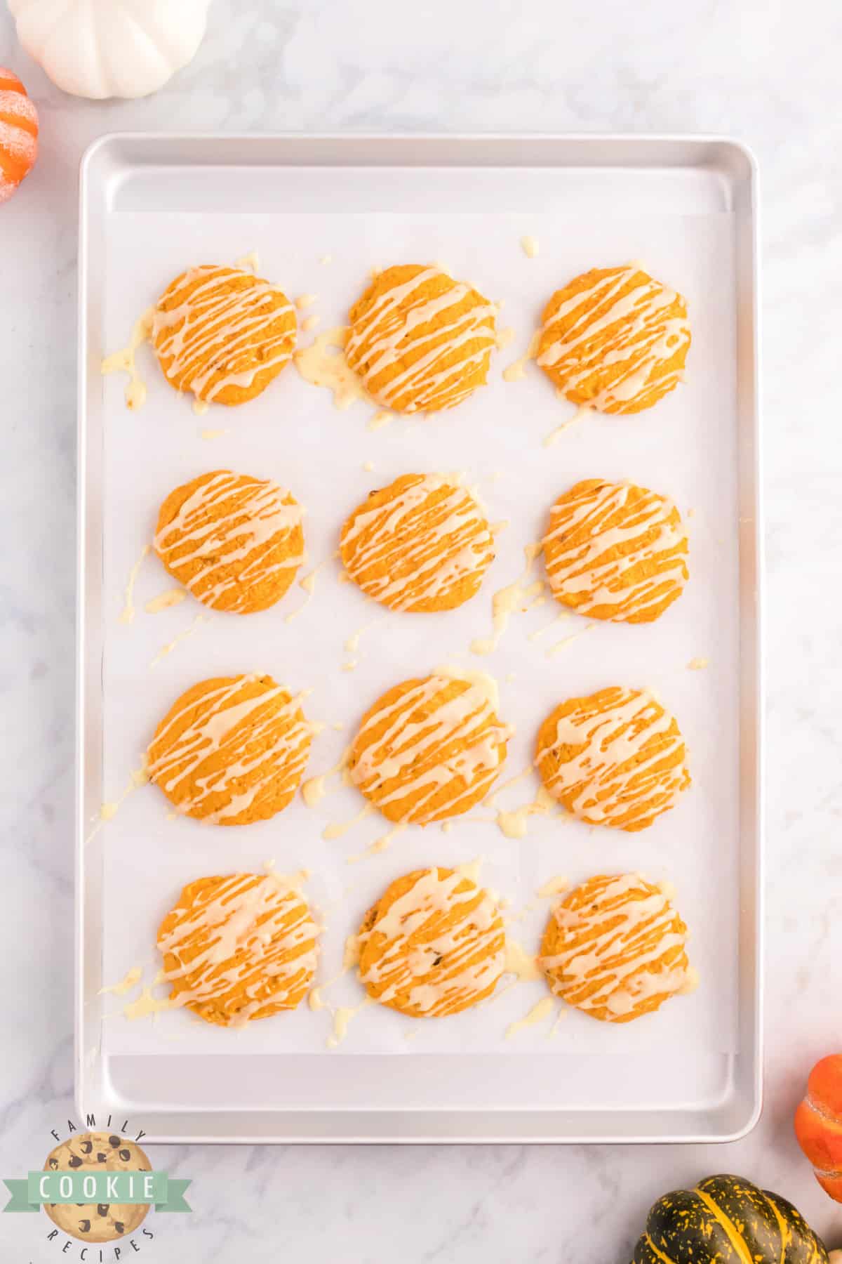 Orange Pumpkin Cookies are soft, chewy and perfect for fall! This pumpkin cookie recipe is topped with a simple orange glaze that complements the pumpkin flavor perfectly. 