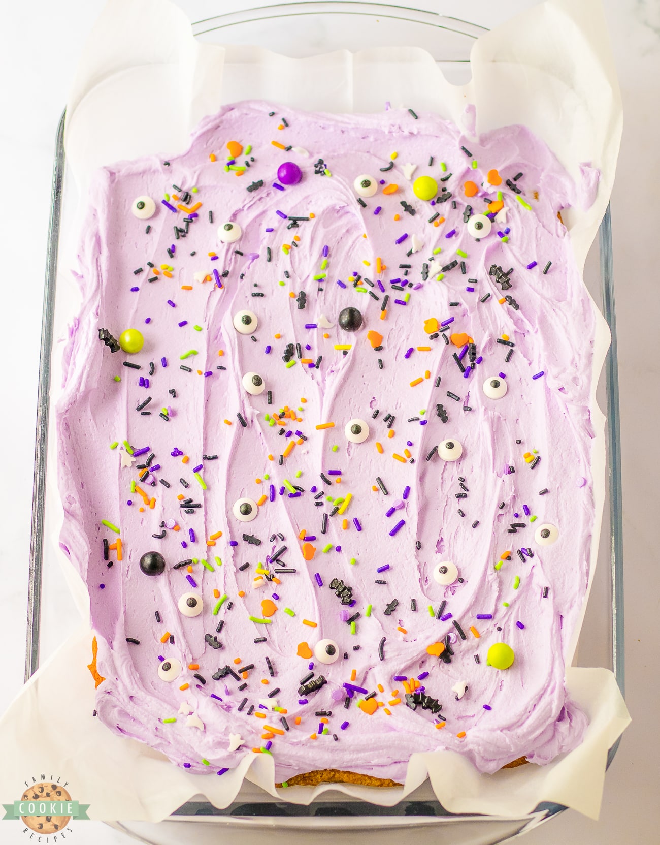 pan of frosted Halloween Sugar Cookie bars with purple buttercream