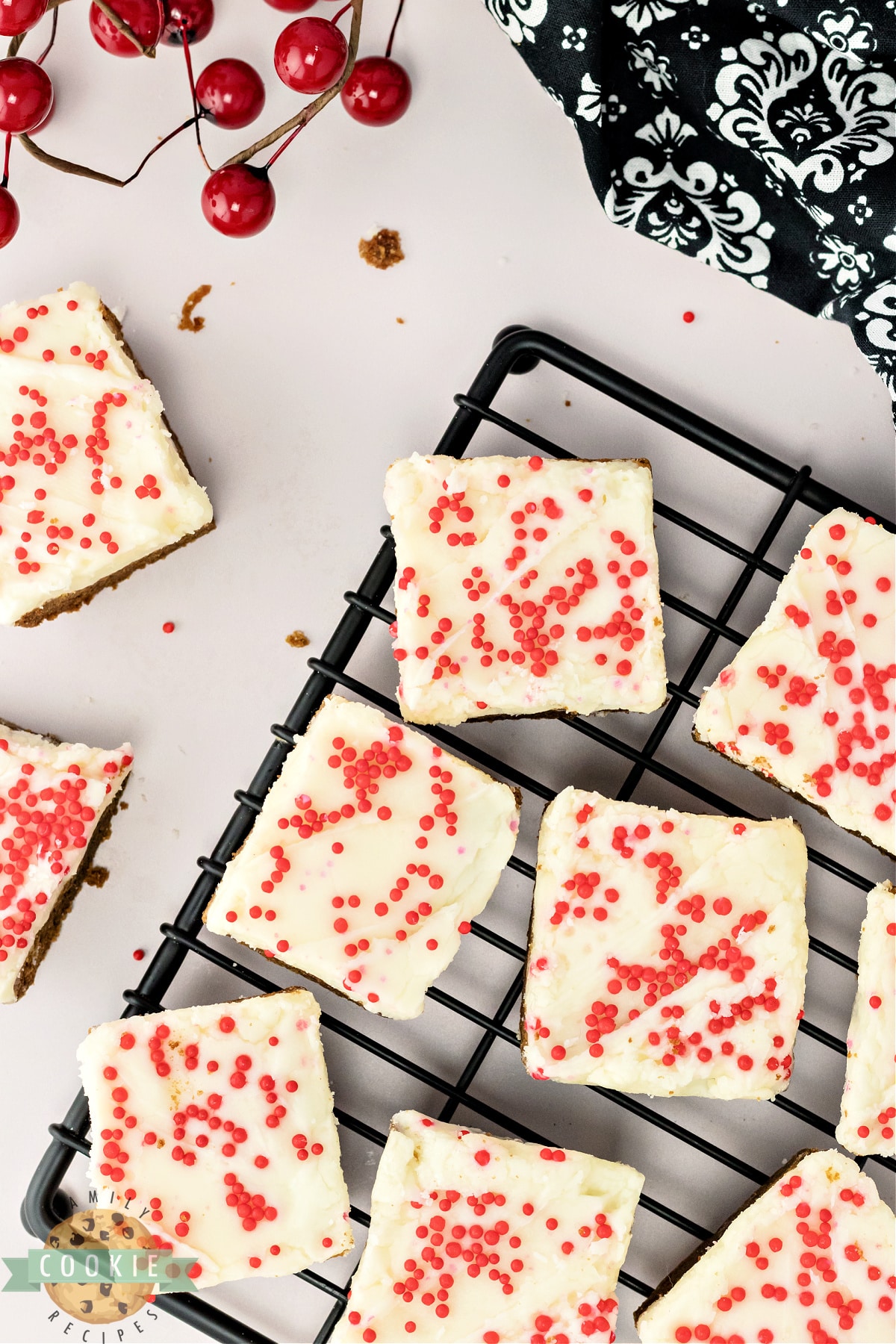 Sliced gingerbread cookie bars with frosting and sprinkles. 