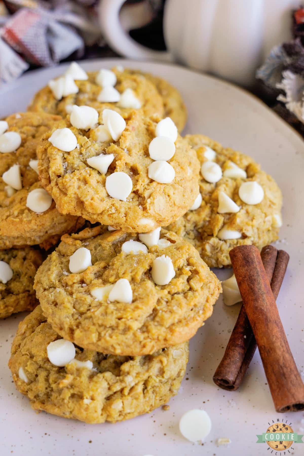 Plate of cookies made with oats, pumpkin and white chocolate chips.