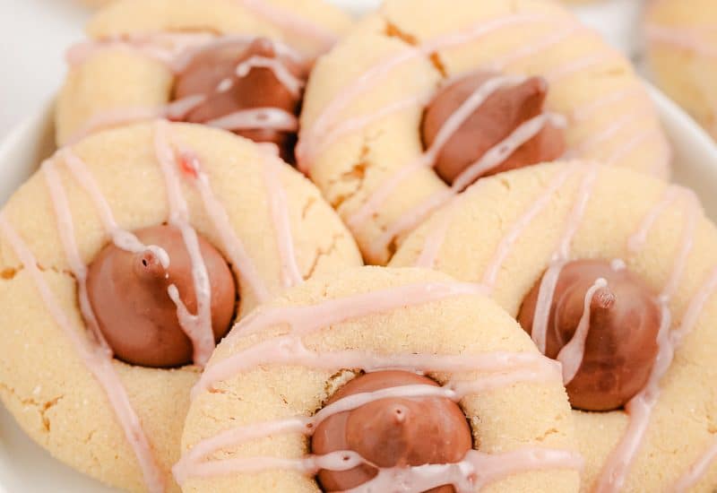raspberry almond kiss cookies on a white plate