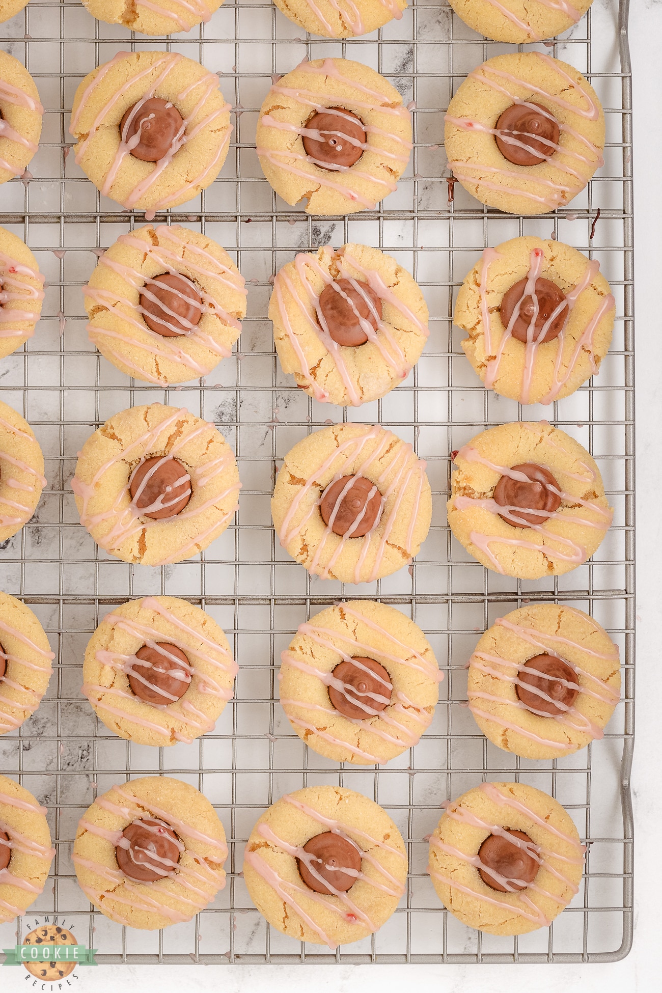 raspberry almond kiss cookies on a cooling rack