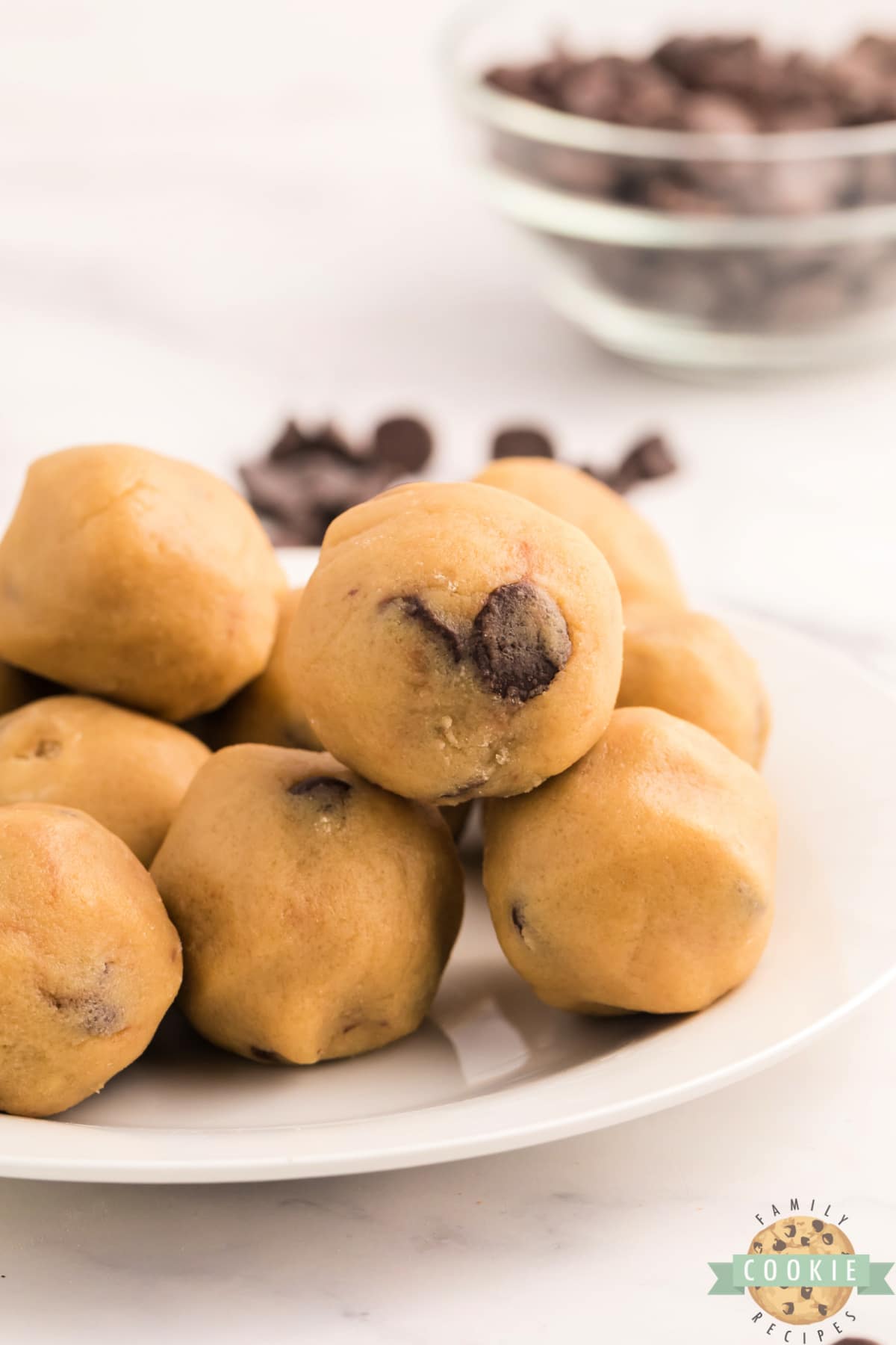 Chocolate Chip Cookie Dough Bites are the ultimate way to enjoy eating raw cookie dough, without worrying about the uncooked egg and flour.  Edible chocolate chip cookie dough that is safe to eat, and perfectly portioned for a quick treat!