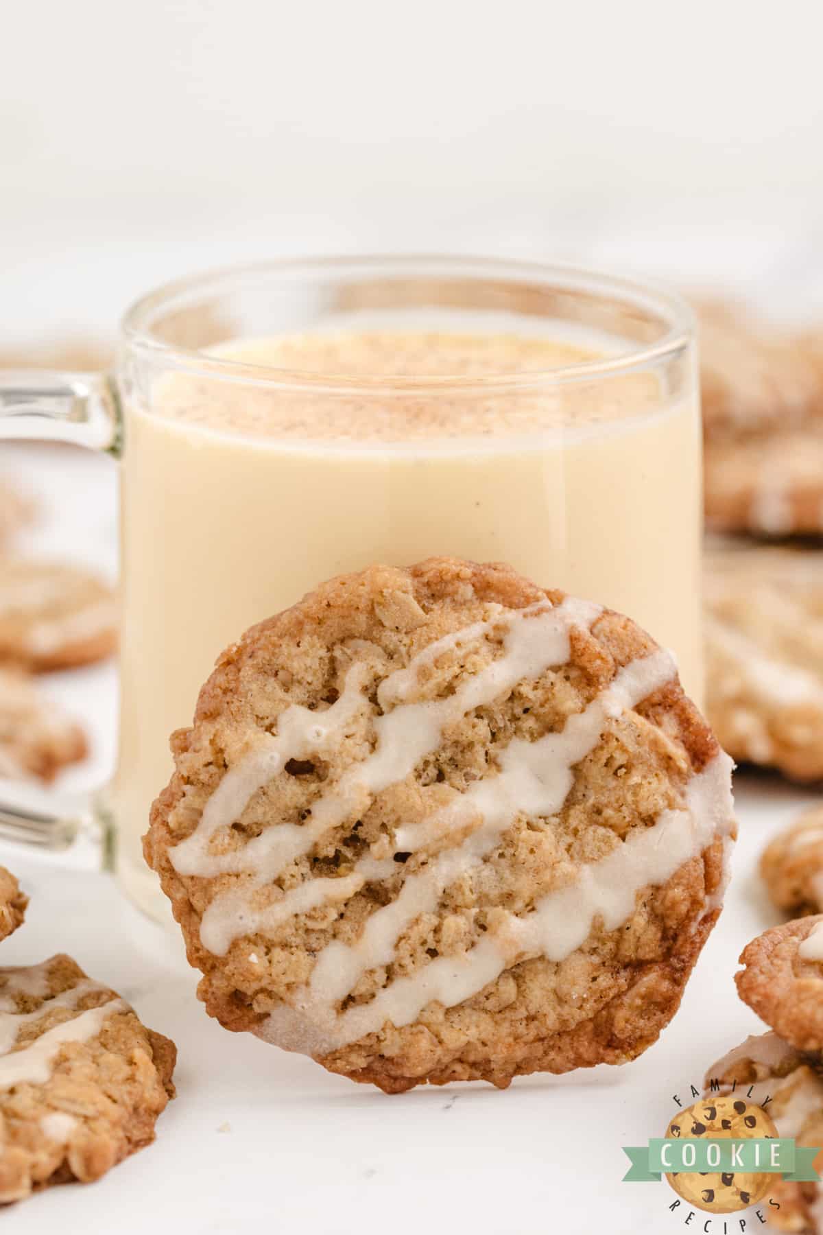 Oatmeal cookie and a glass of eggnog.