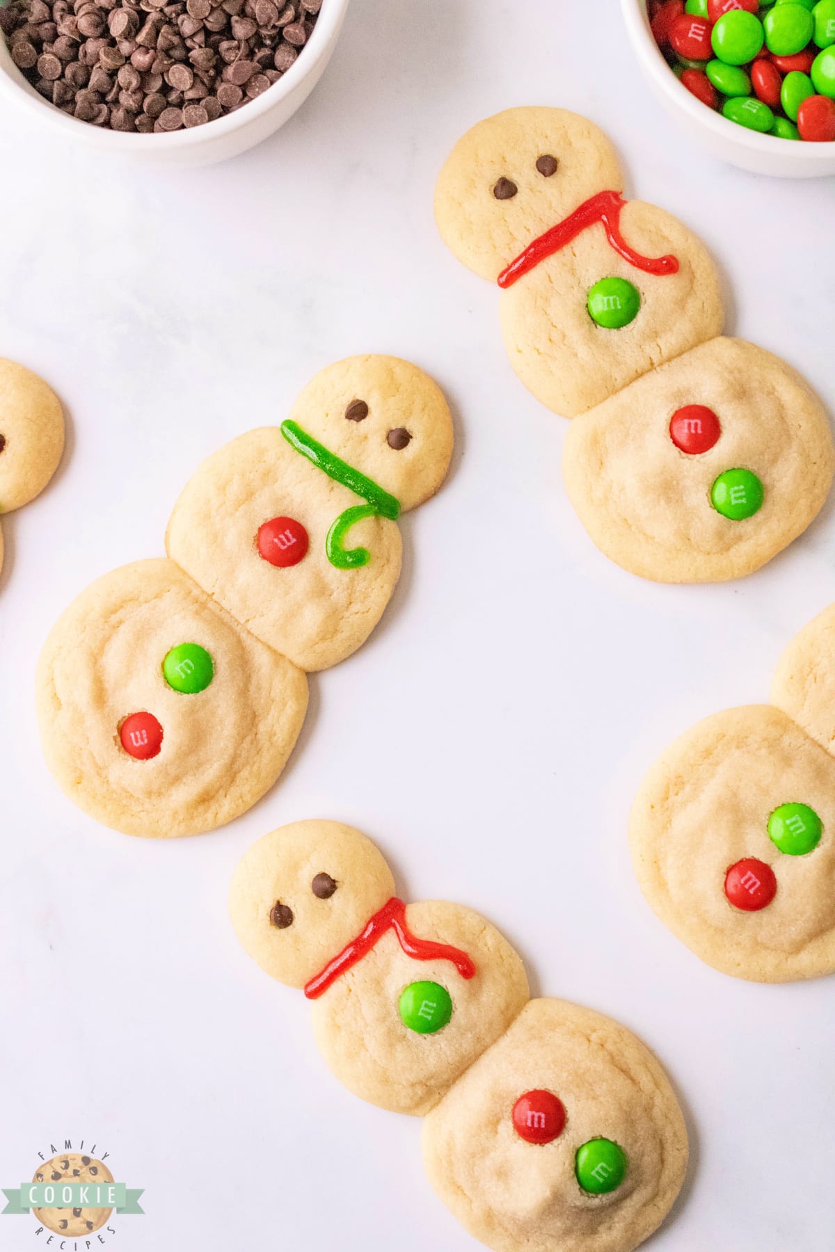These Snowman Sugar Cookies are the perfect holiday recipe. They're soft, chewy and full of rich vanilla flavor. Delicious sugar cookie recipe that doesn't require any chilling, cookie cutters or frosting! 