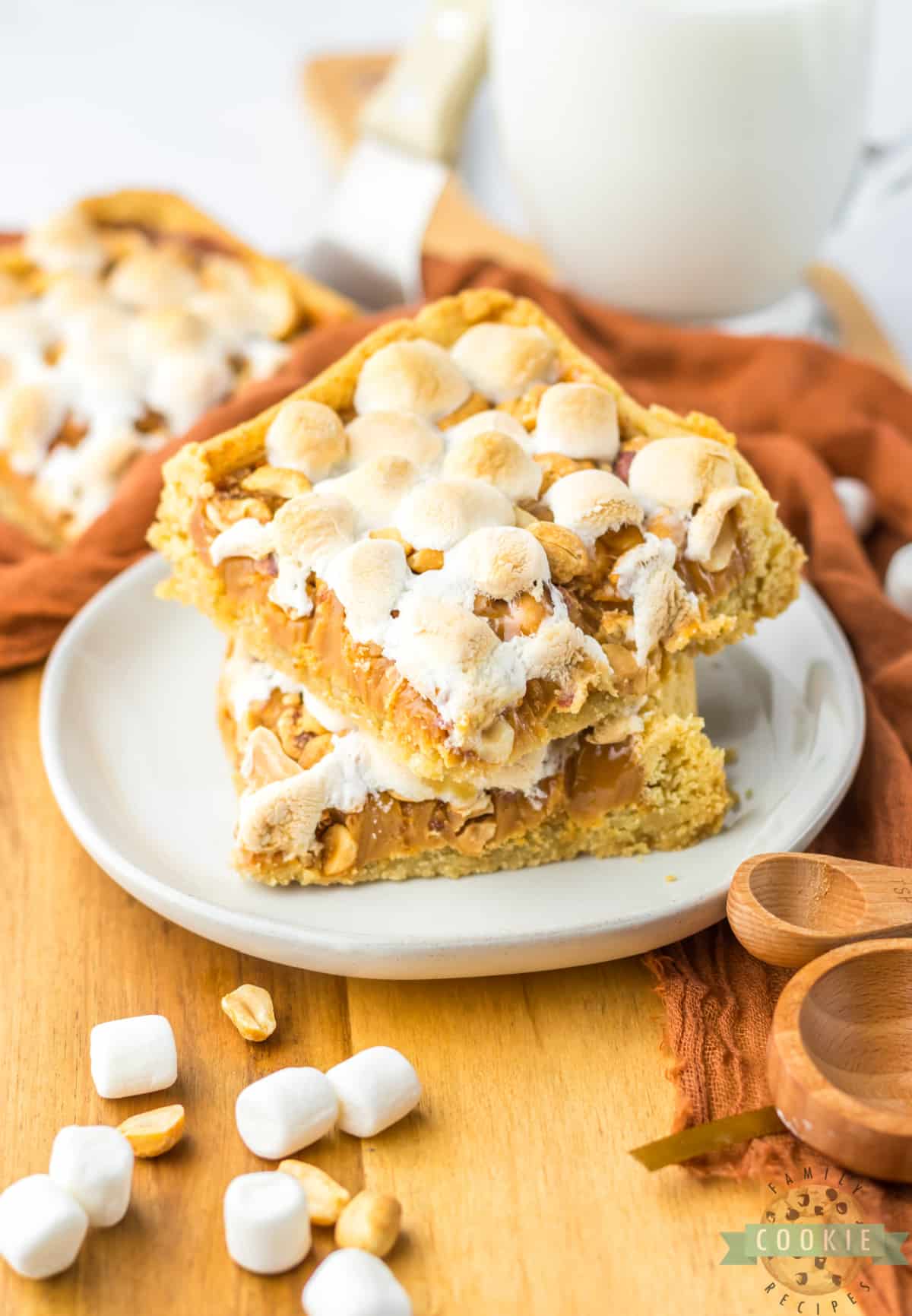 Easy Peanut Caramel Cookie Bars are made with only 5 ingredients! Chewy cookie bar recipe made with a sugar cookie crust that is topped with melted caramel, peanuts and marshmallows. 